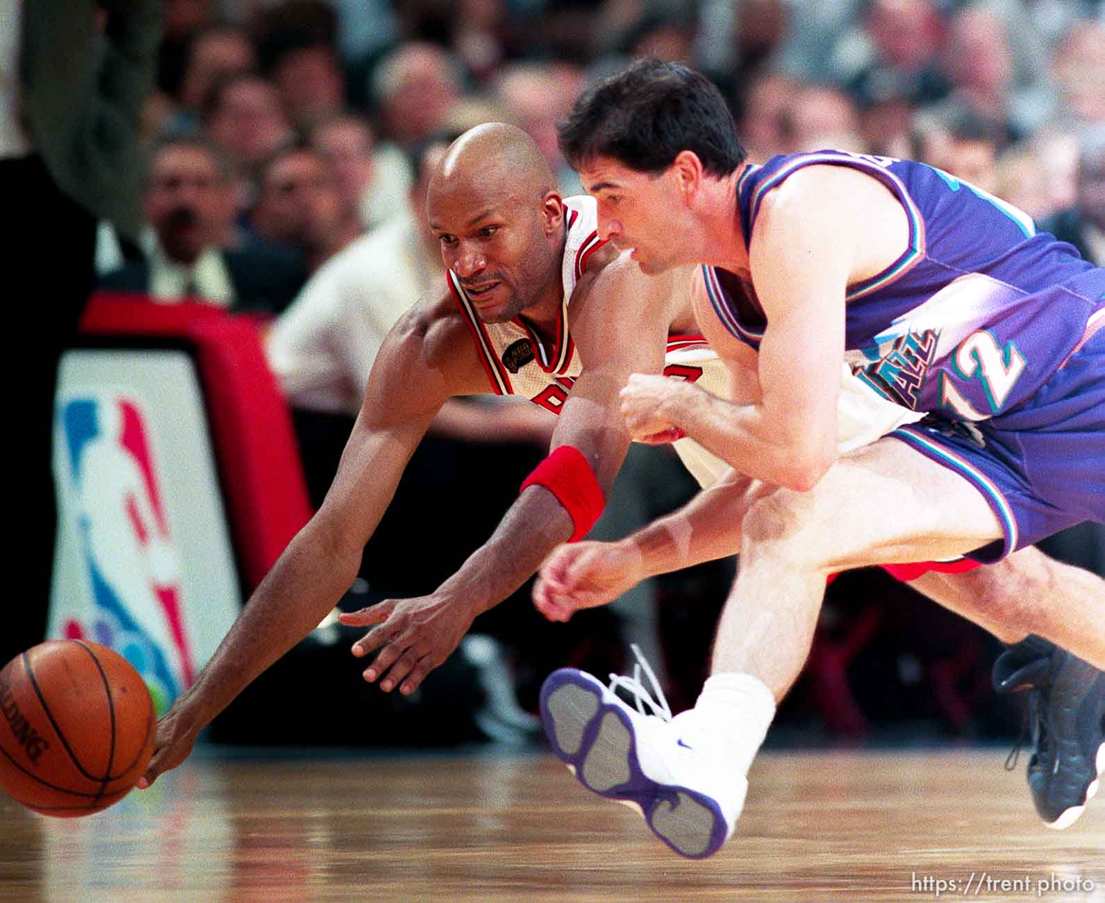 Ron Harper and John Stockton scramble for a loose ball at Jazz vs. Bulls, game 4 of the NBA Finals. Bulls won