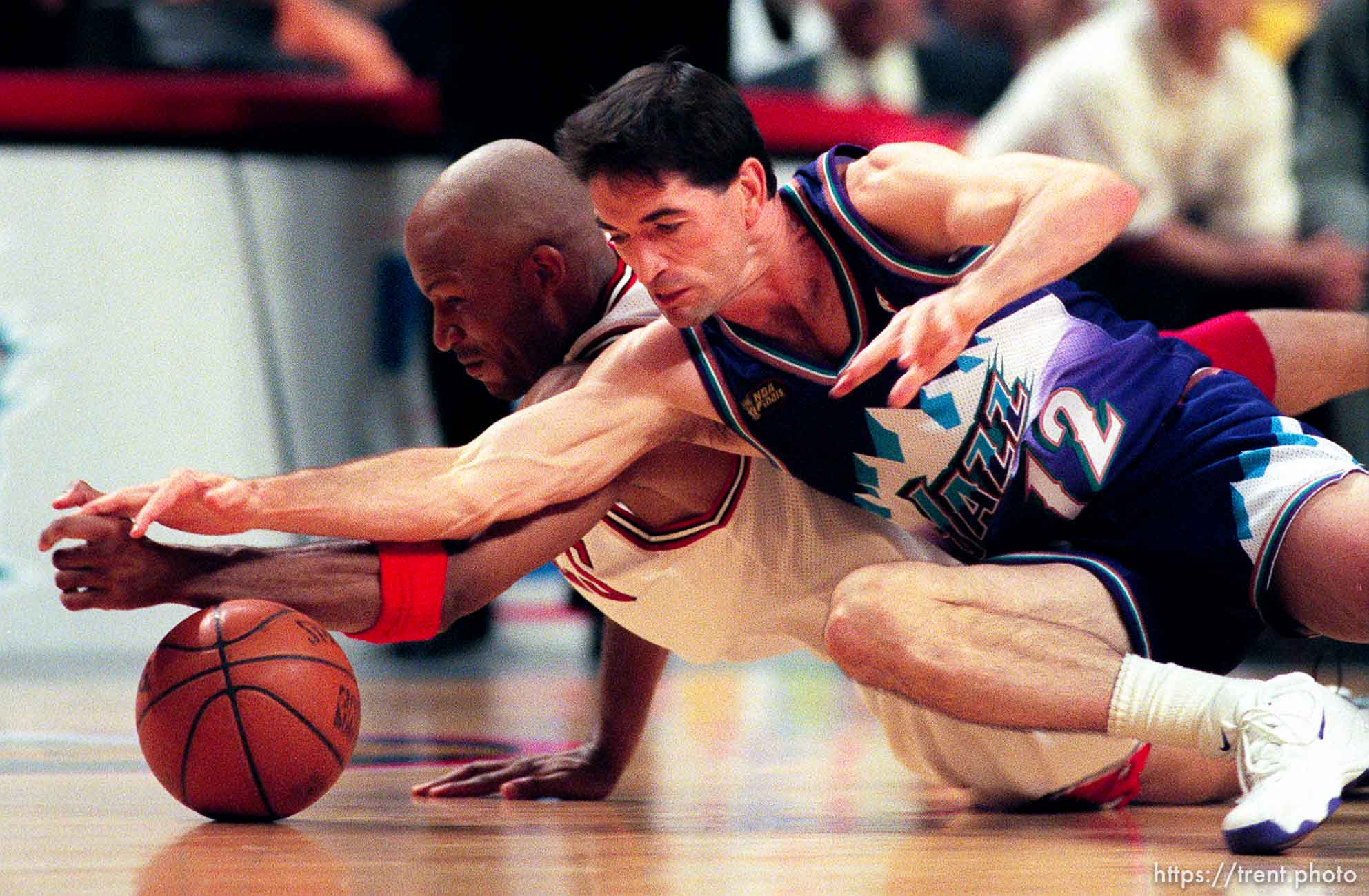 Ron Harper and John Stockton scramble for a loose ball at Jazz vs. Bulls, game 4 of the NBA Finals. Bulls won