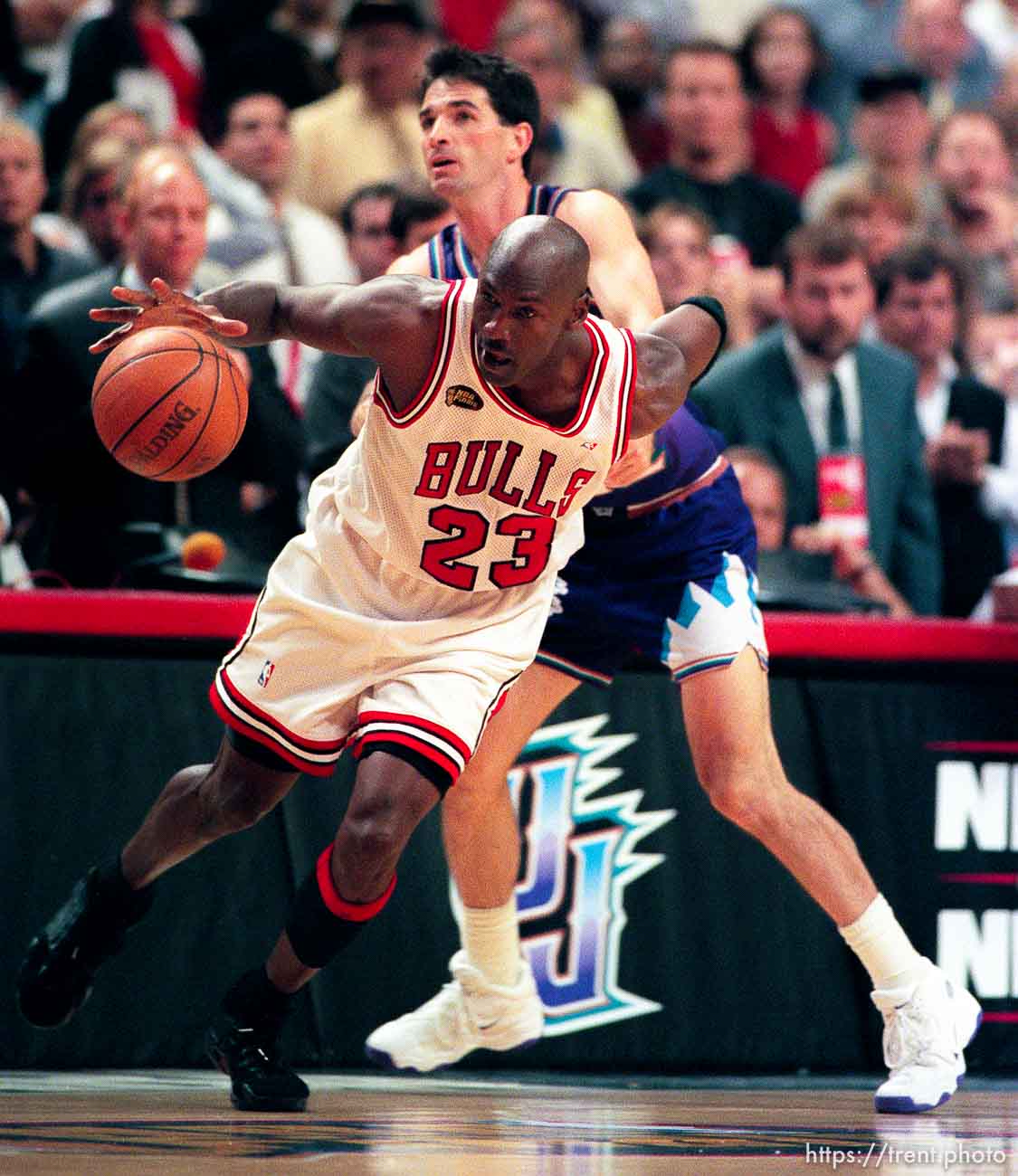 Michael Jordan is fouled by John Stockton at Jazz vs. Bulls, game 4 of the NBA Finals. Bulls won