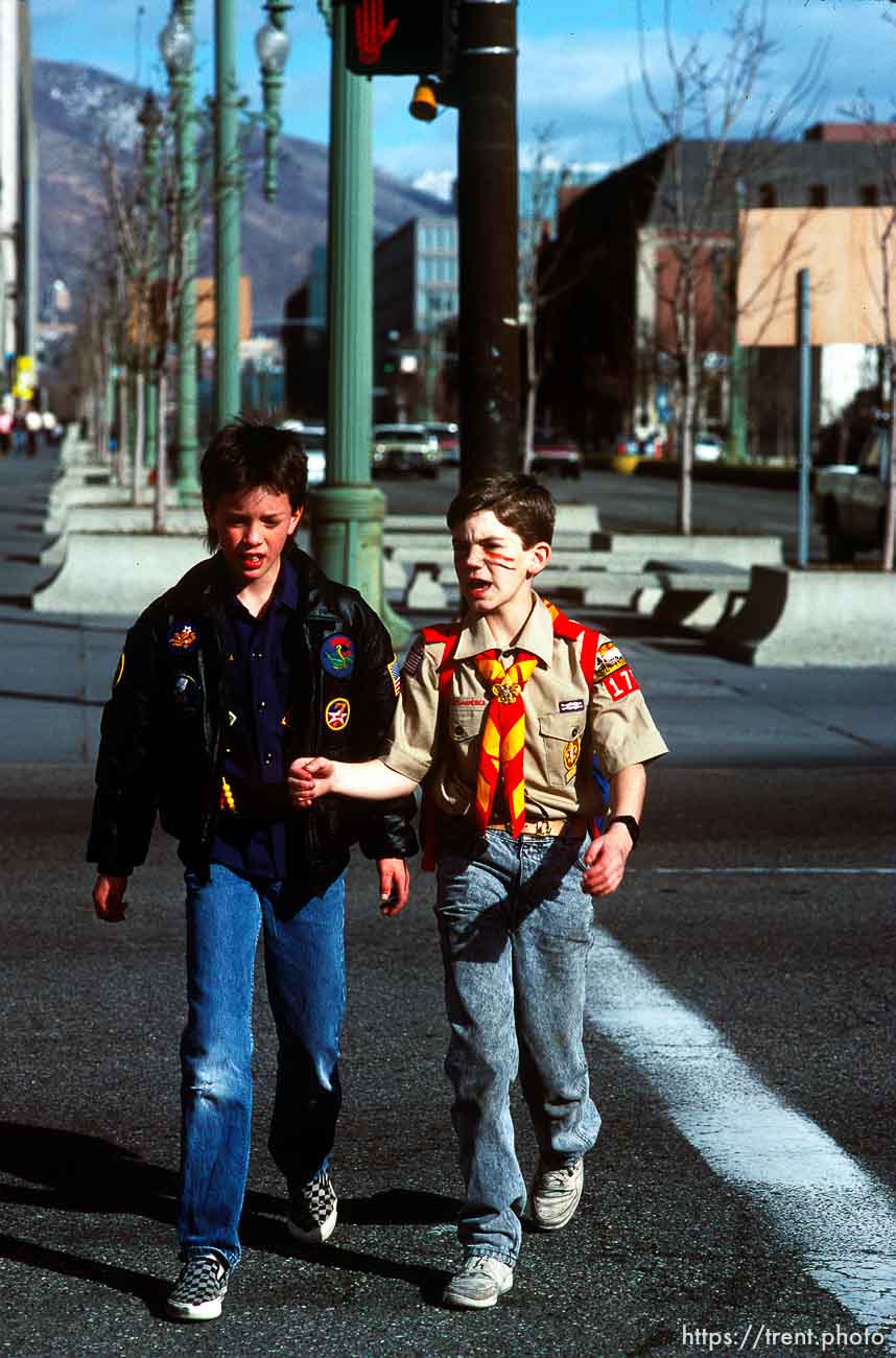 Two scouts walking downtown (100 S, W Temple) to the Scout-a-rama at the Salt Palace, march 1988.