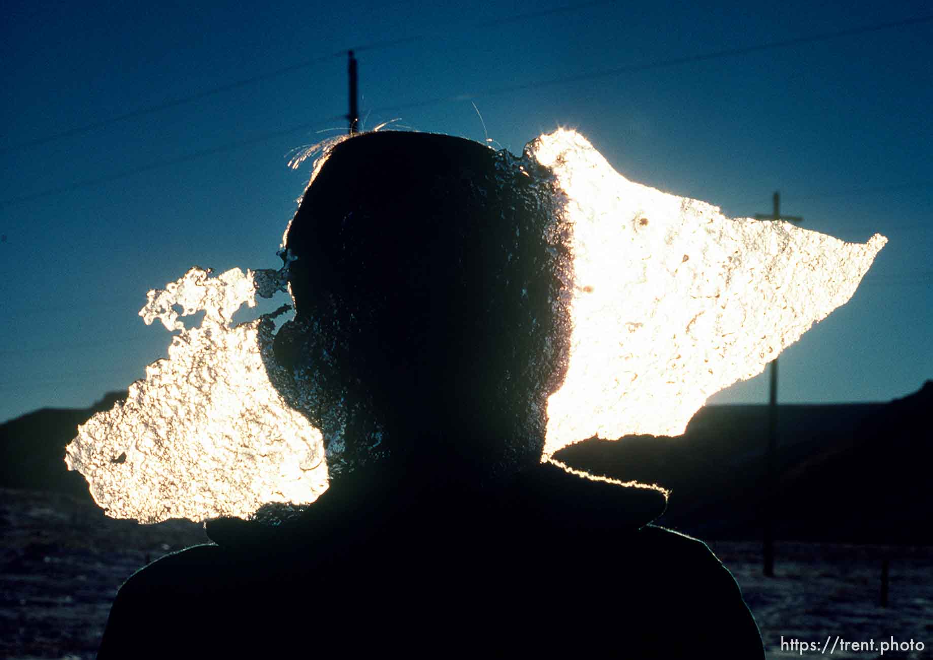 CG holds a piece of ice in front of his face, march 1988.