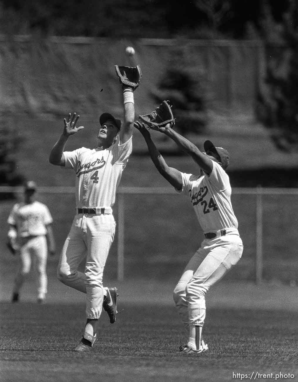 BYU vs University of Utah college baseball action. Paul Cluff, left, Bruce Ellis.