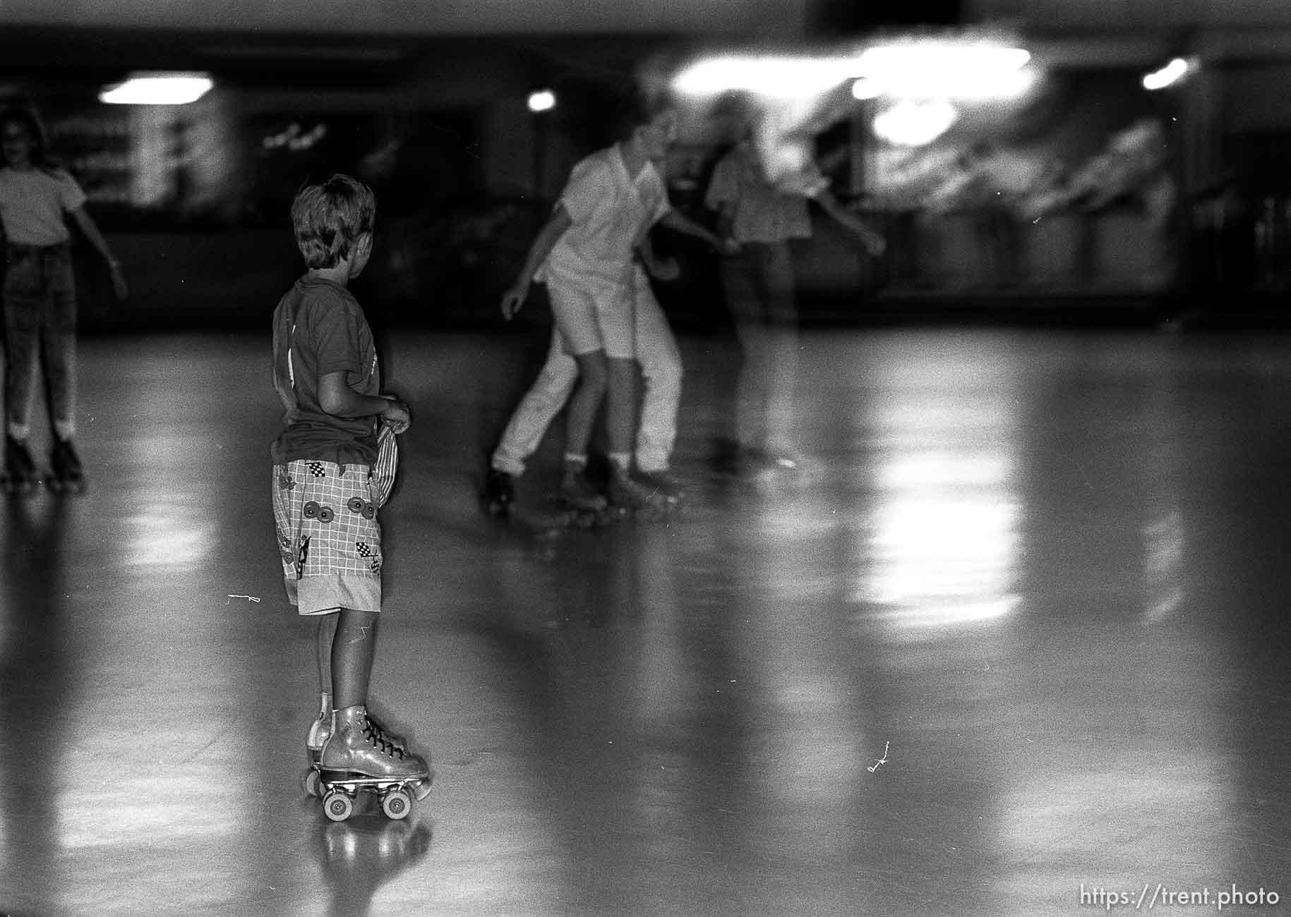 Kids roller-skating at Classic Skating Rink.