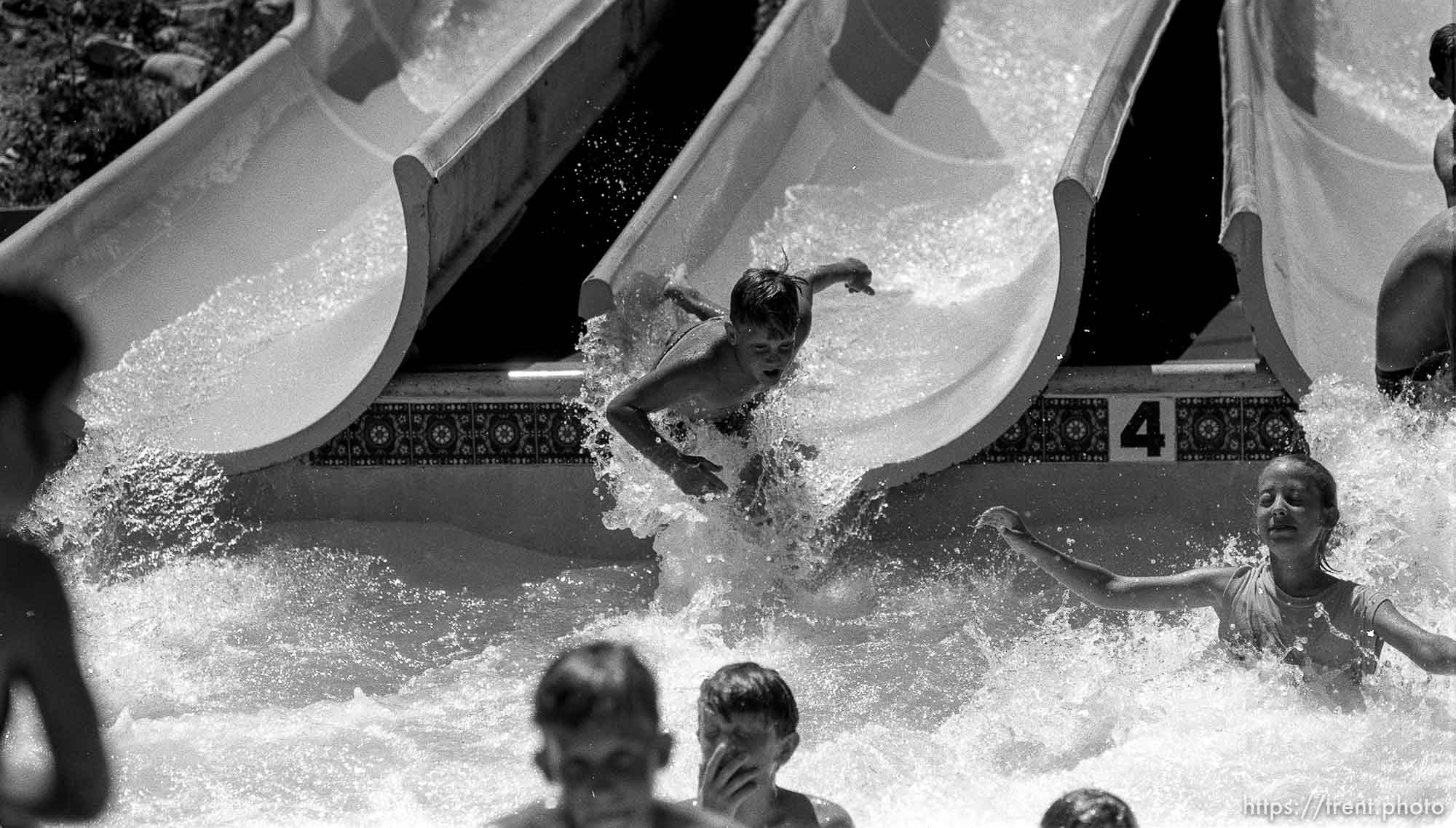 Kids water-sliding at Classic Skating Rink.