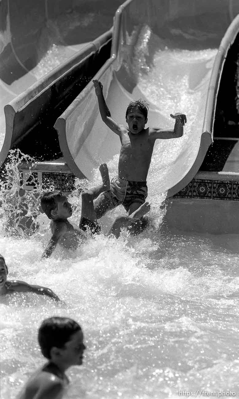 Kids water-sliding at Classic Skating Rink.