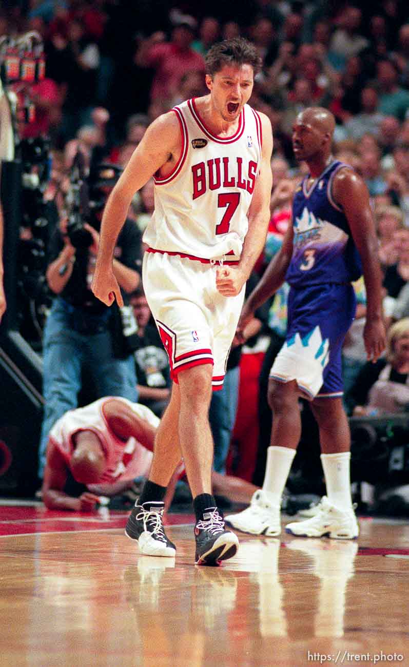 Toni Kukoc celebrates as Bryon Russell walks away at Jazz vs. Bulls, game 3 of the NBA Finals. Bulls won