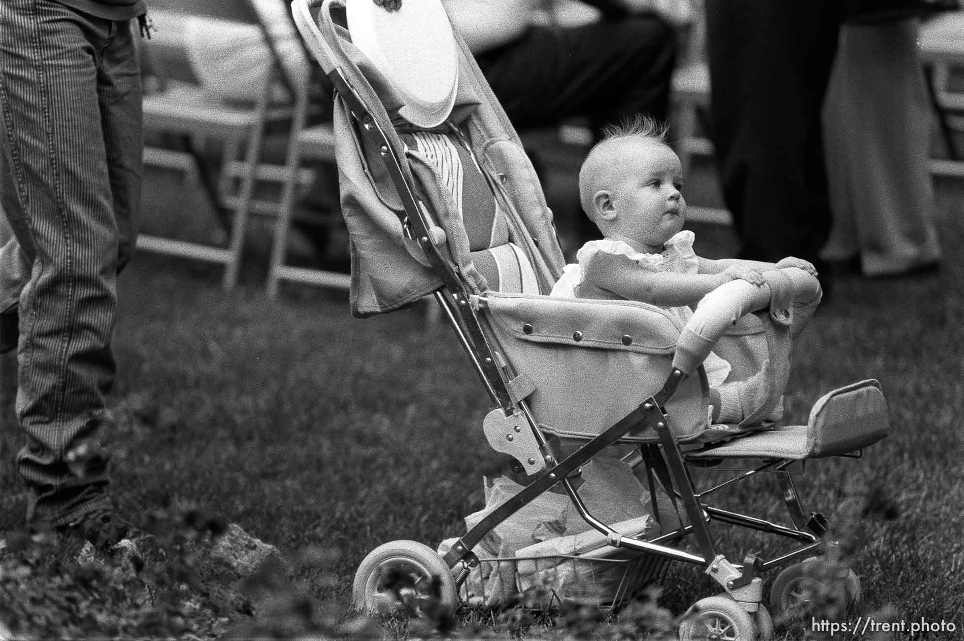 Kid in stroller at 34th annual Salmon Supper at Memorial Park.