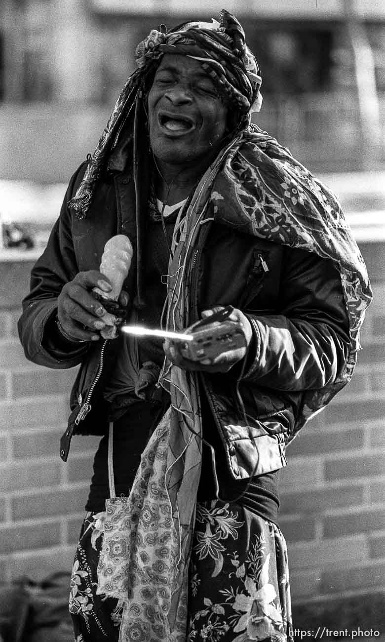 Man singing into a dildo on Market Street, Sepember 1988.