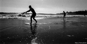 Joey, John skimboarding.