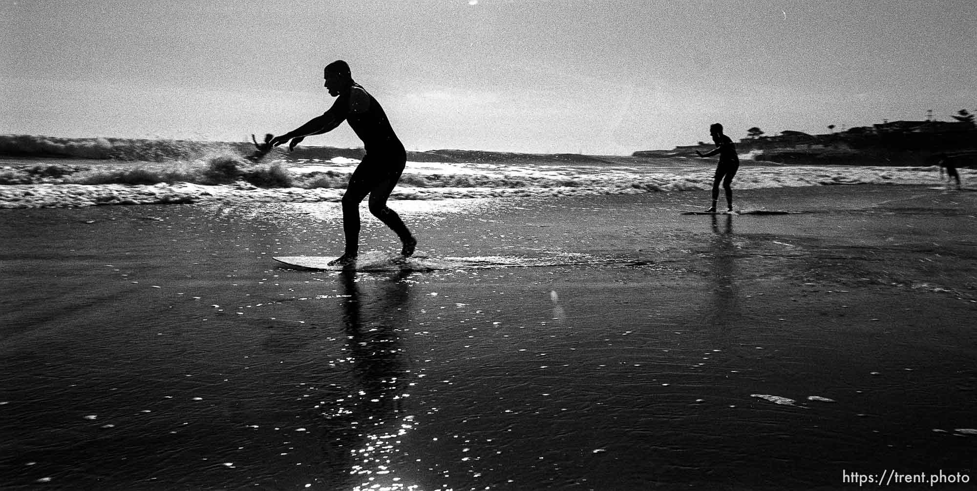 Joey, John skimboarding.