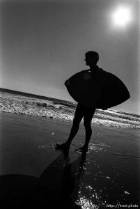 Peter skimboarding.