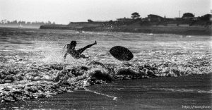 Peter skimboarding.