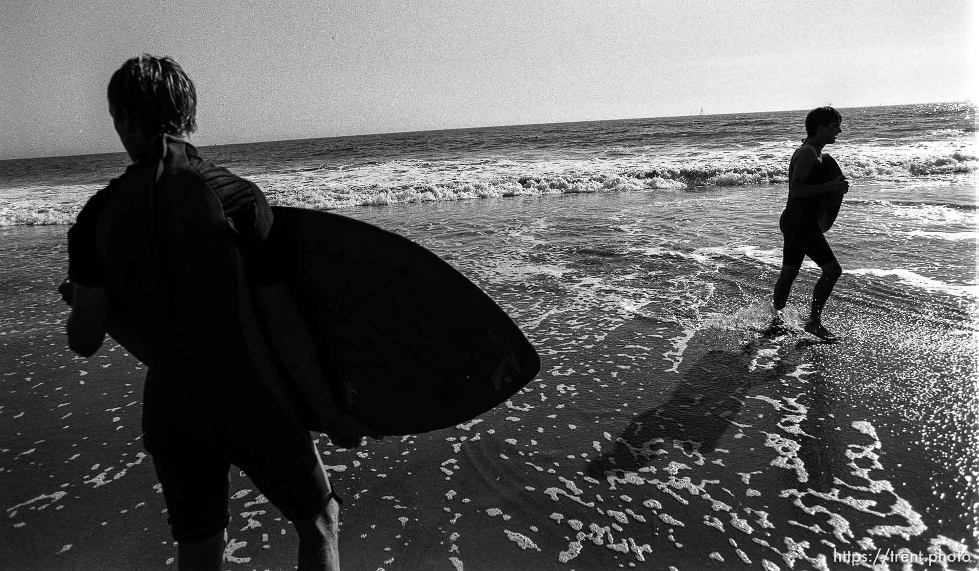 John , Peter skimboarding.