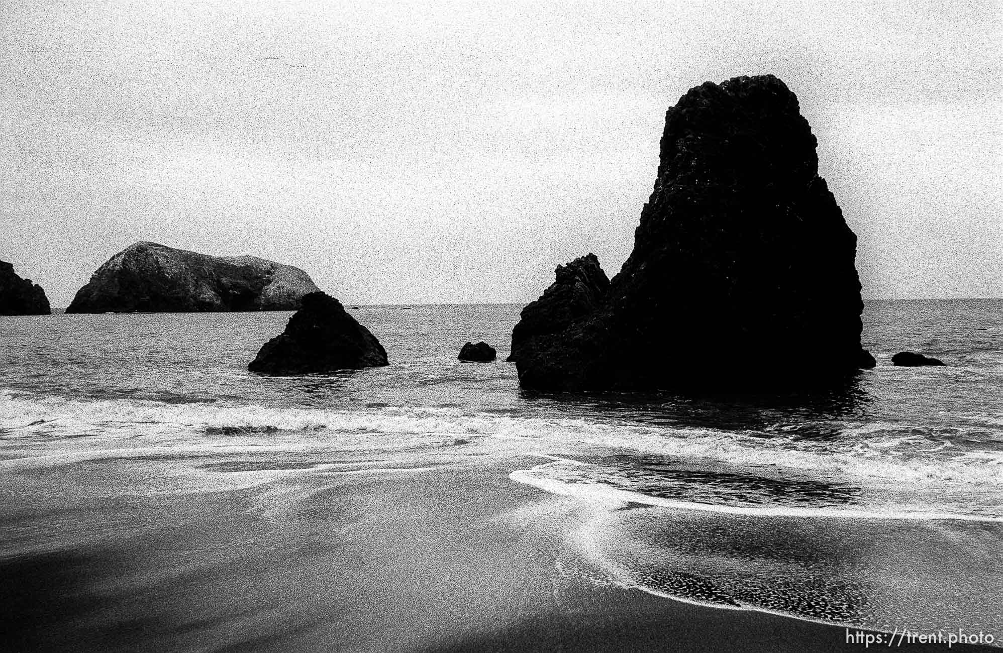 rocks and waves at beach.