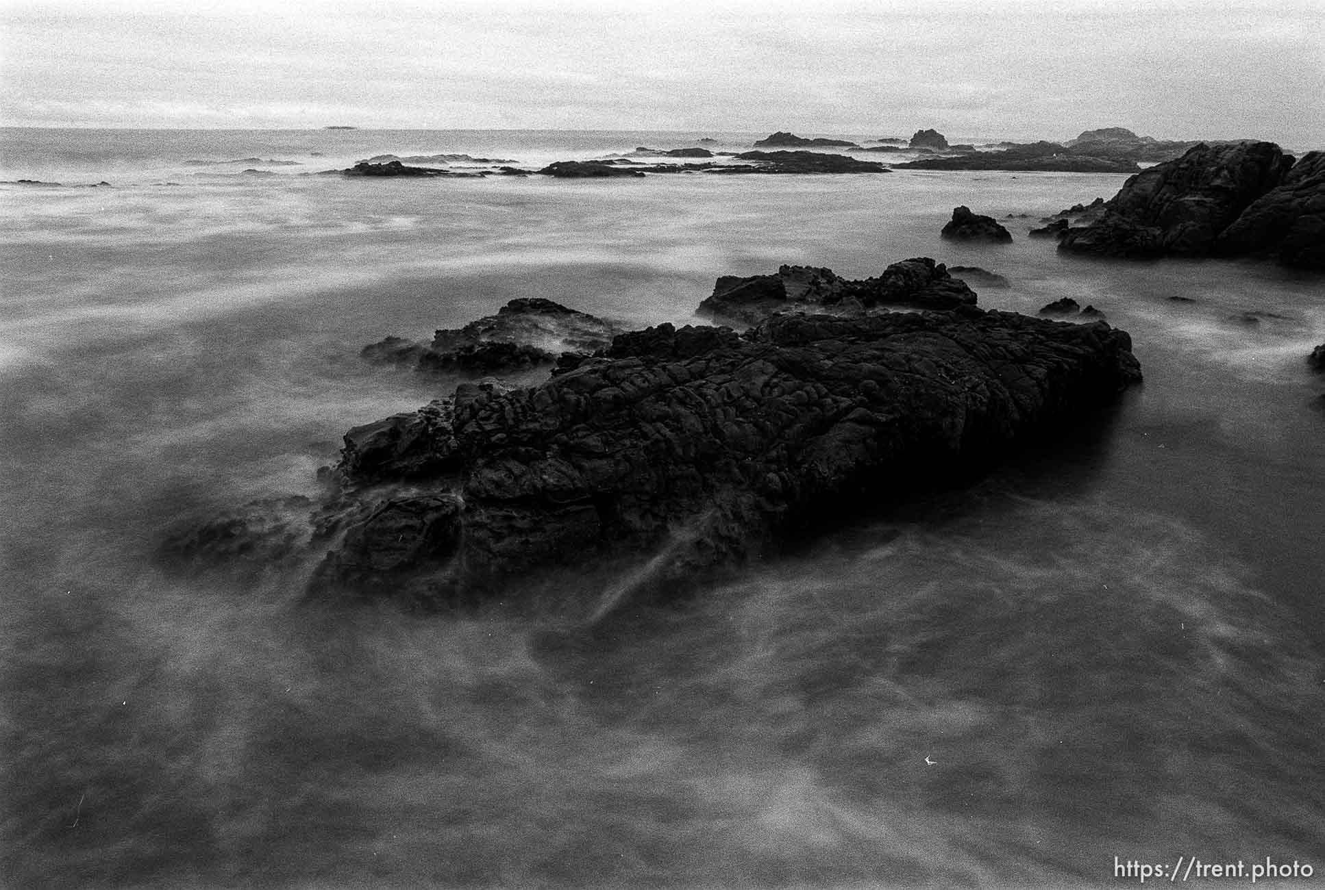 Slow-shutter waves and rocks at Pebble Beach.