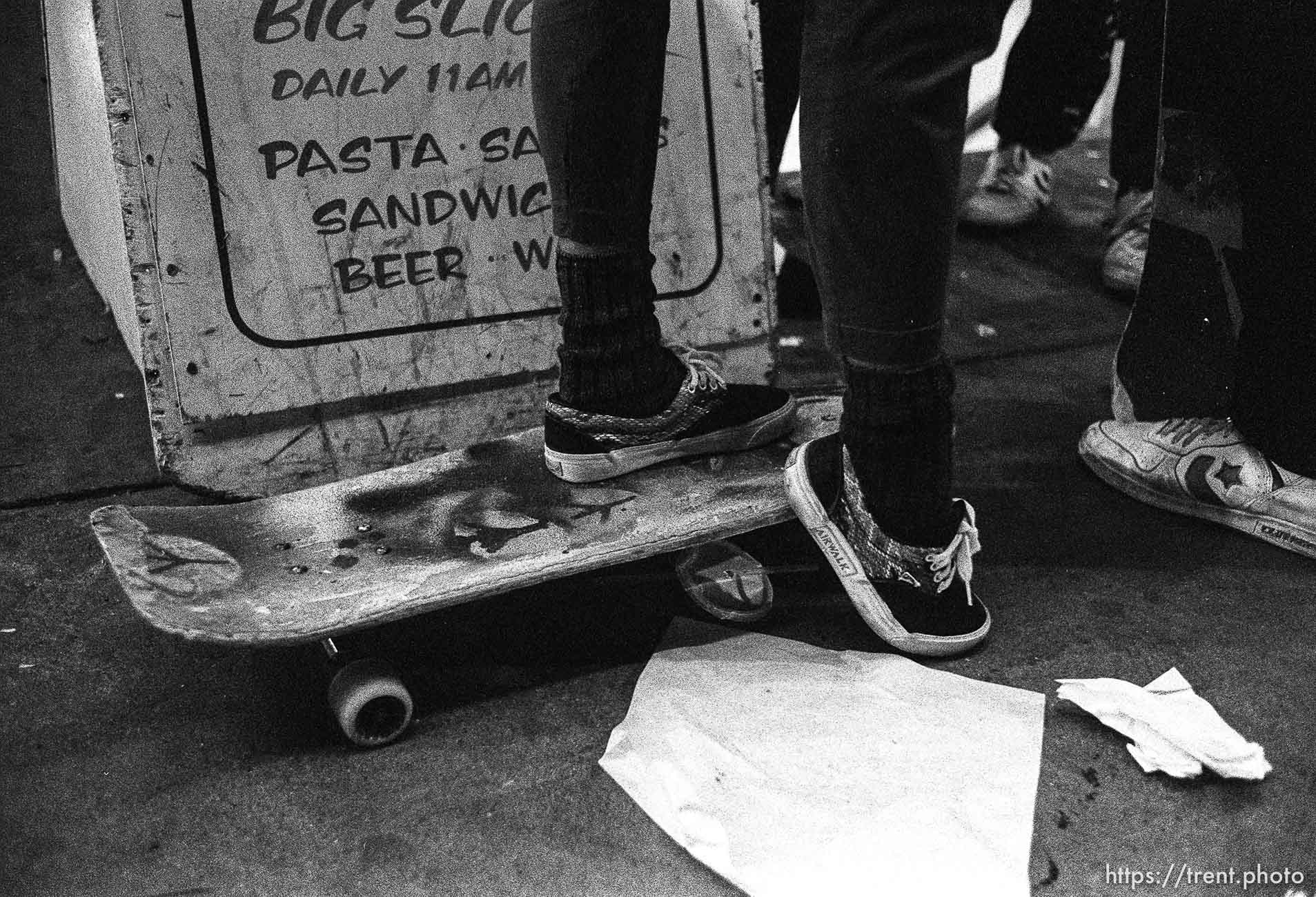 Skate punks on Telegraph Avenue at night.