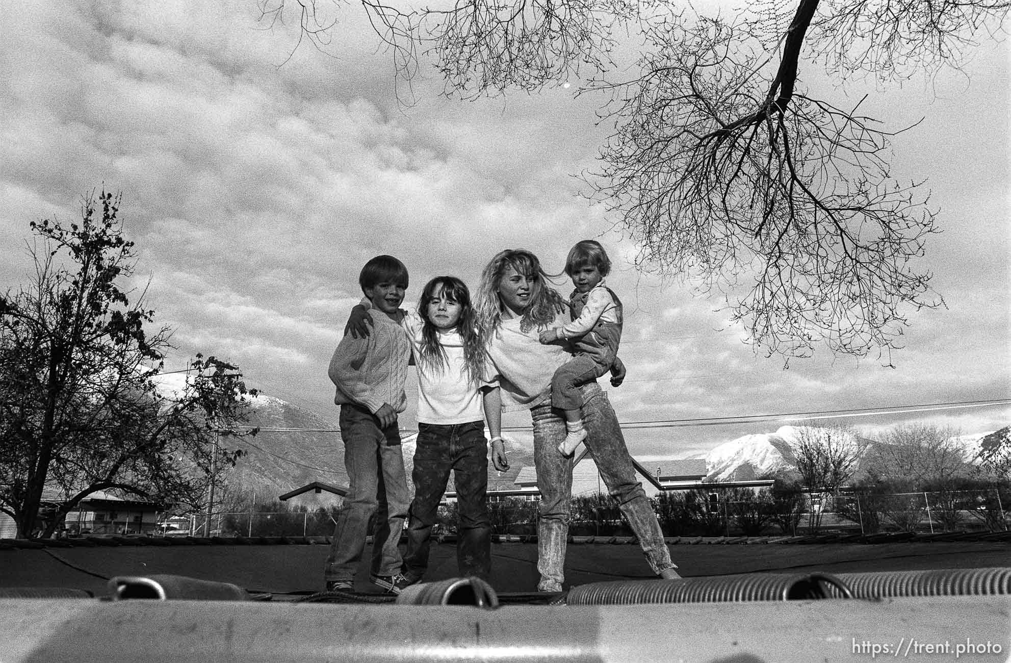 Kids jumping on trampoline.