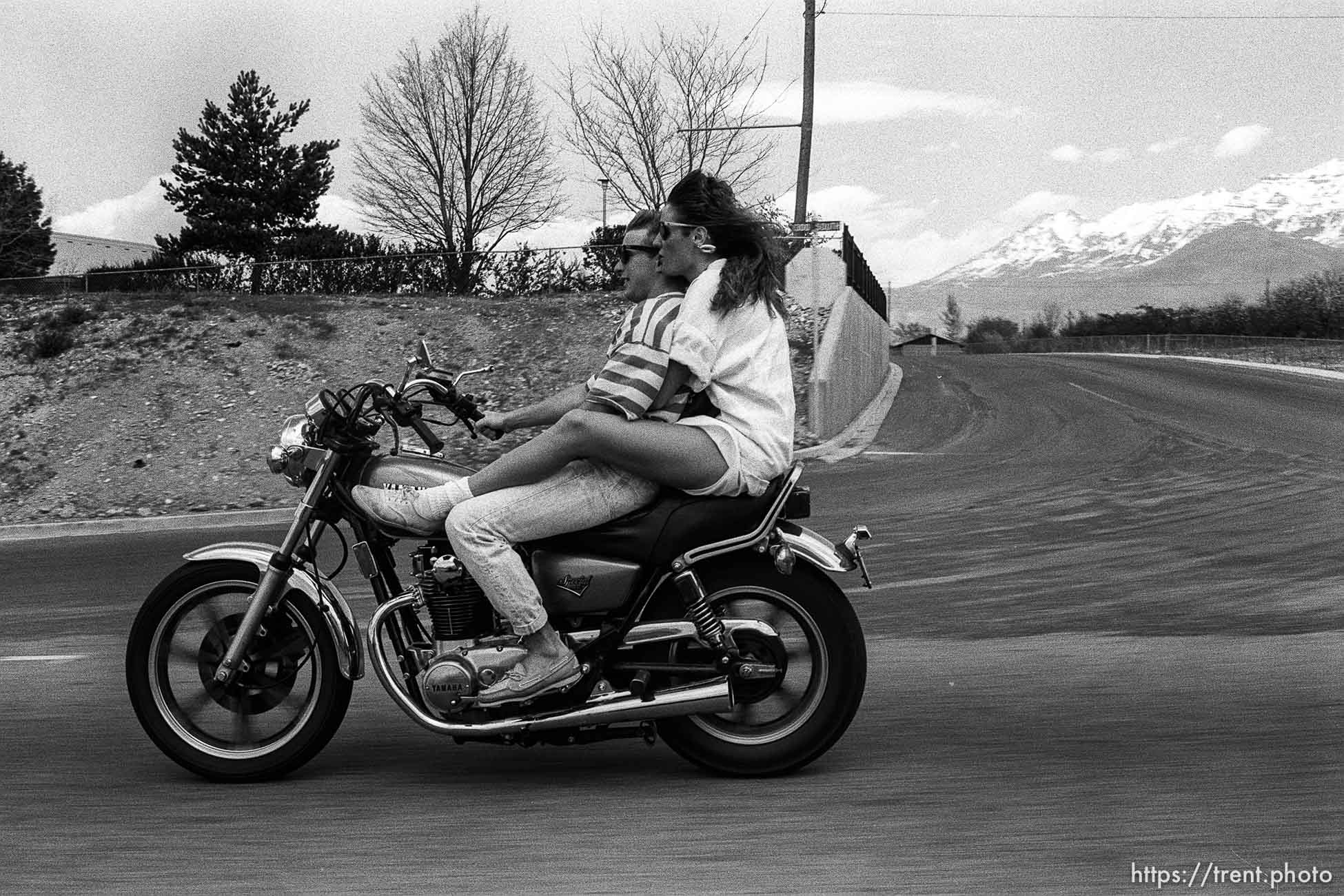 Guy and girl on motorcycle.