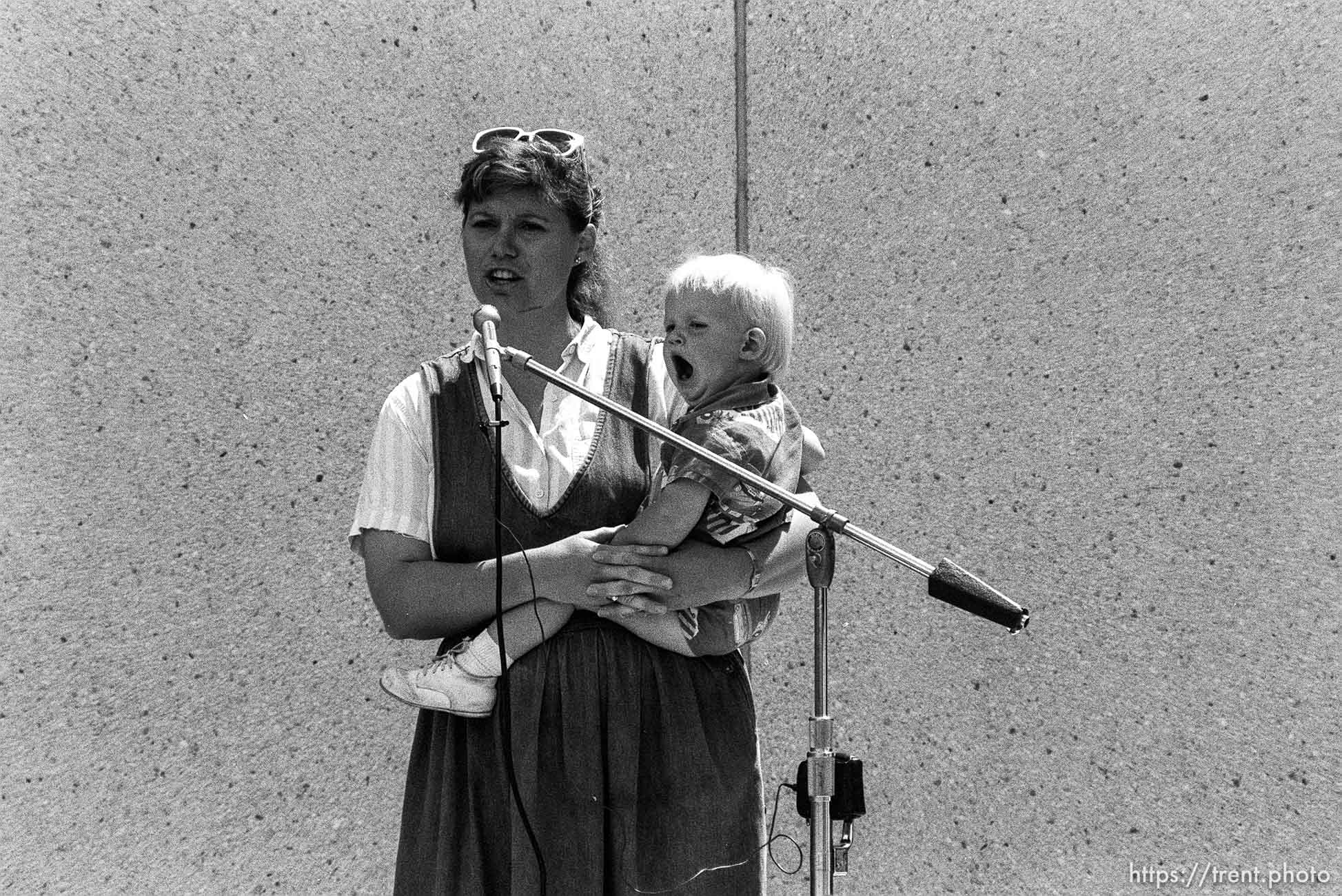 Mom and baby speaking. 1 of a series (baby yawns, mother emotional). Student BYU rally protesting Tiananmen Square massacre in China.