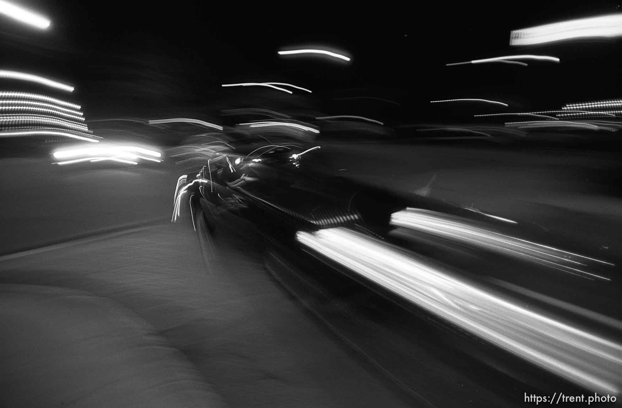 Car (cruising) on Center Street at night.