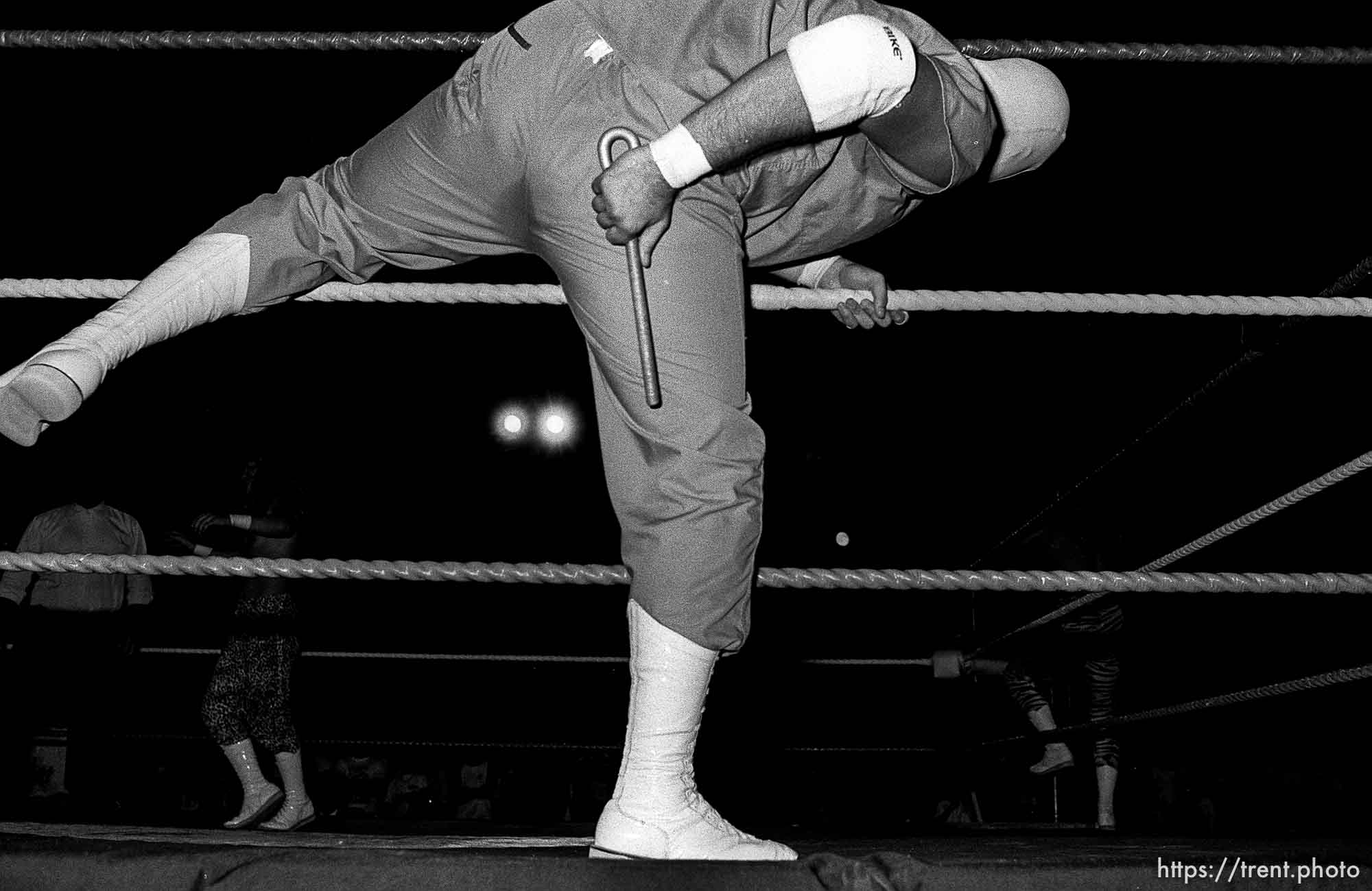 Heel wrestler brings an illegal object into the ring at professional wrestling match.