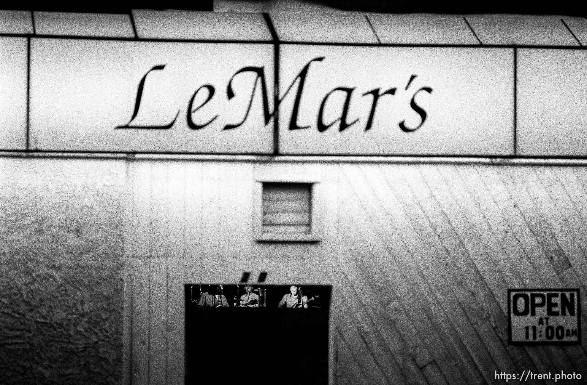 Band playing in LeMar's on Center Street at night.