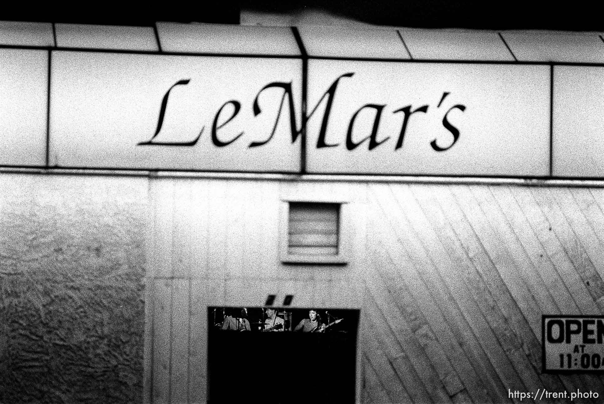 Band playing in LeMar's on Center Street at night.