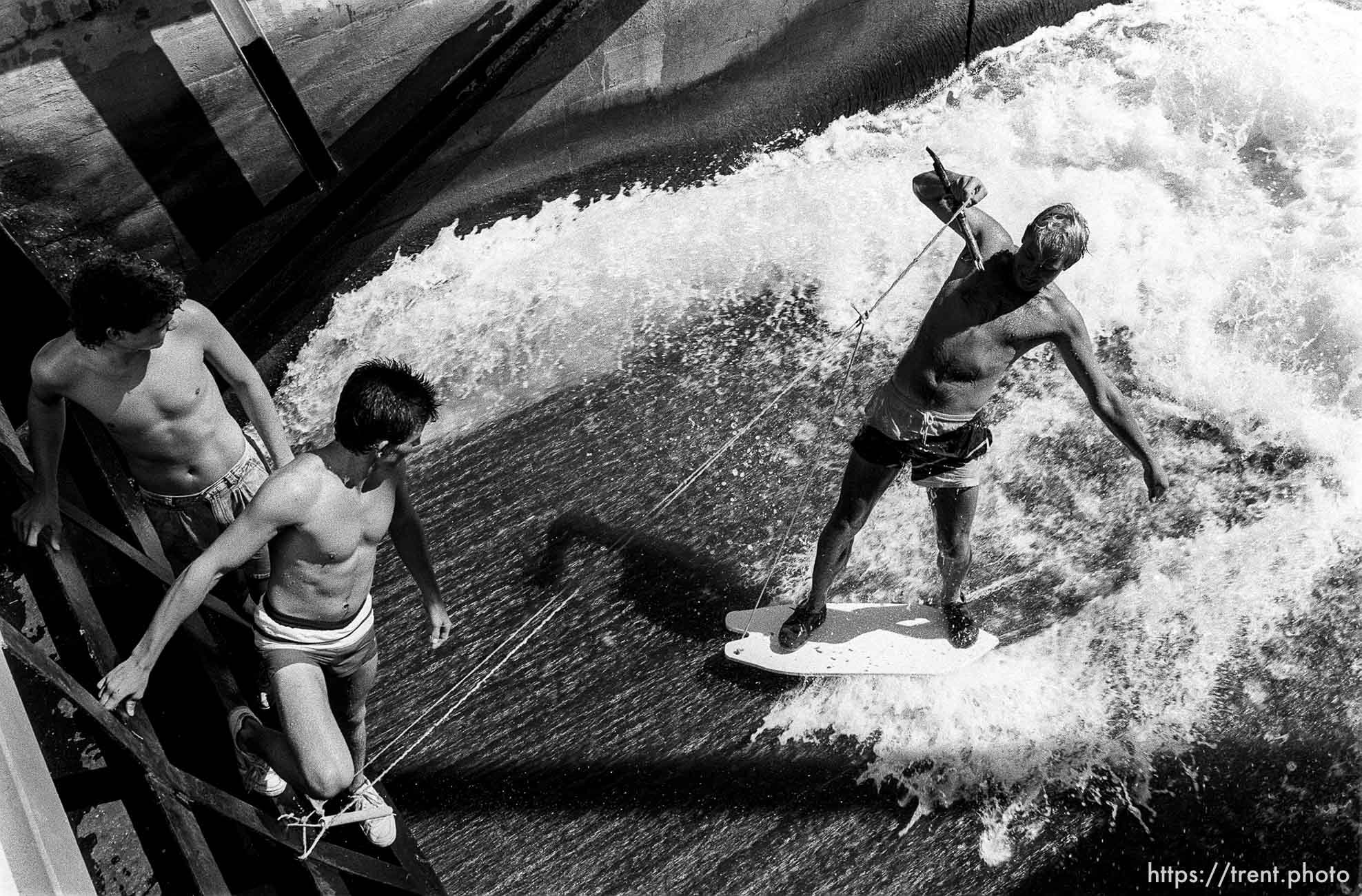 Kids surfing at diversion dam.