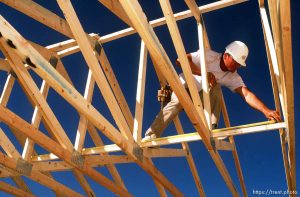 Volunteer helps build a Jehovah's Witness Temple, 1989.