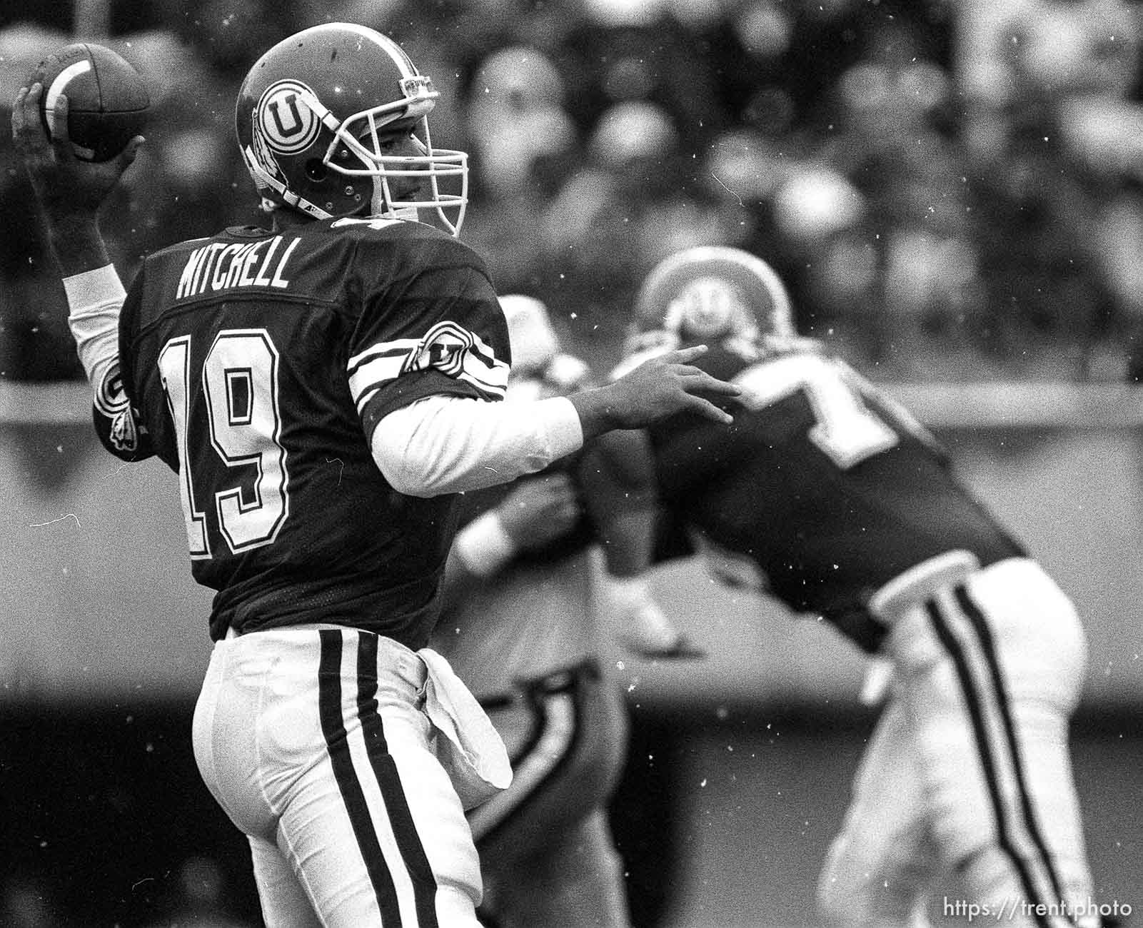 Scott Mitchell passing the ball during football action at Utah vs. Colorado State.