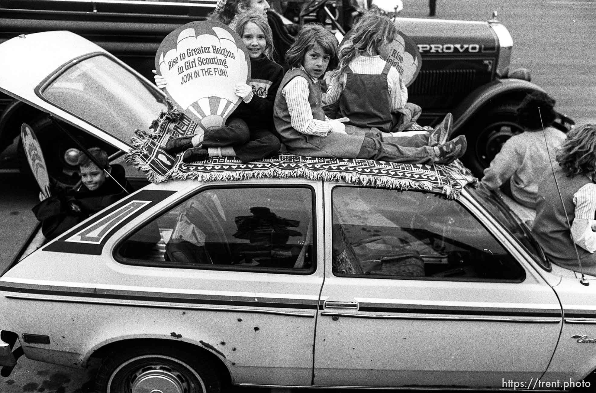 Girl scouts on Pinto getting ready for Christmas Parade.