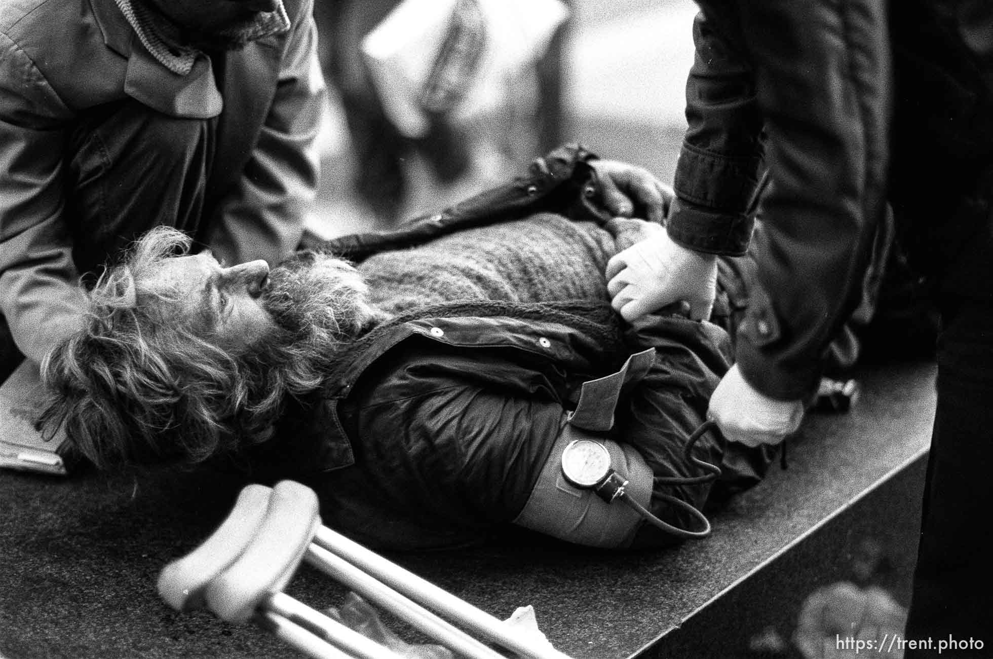 Guy who collapsed is checked by paramedics on Market Street.