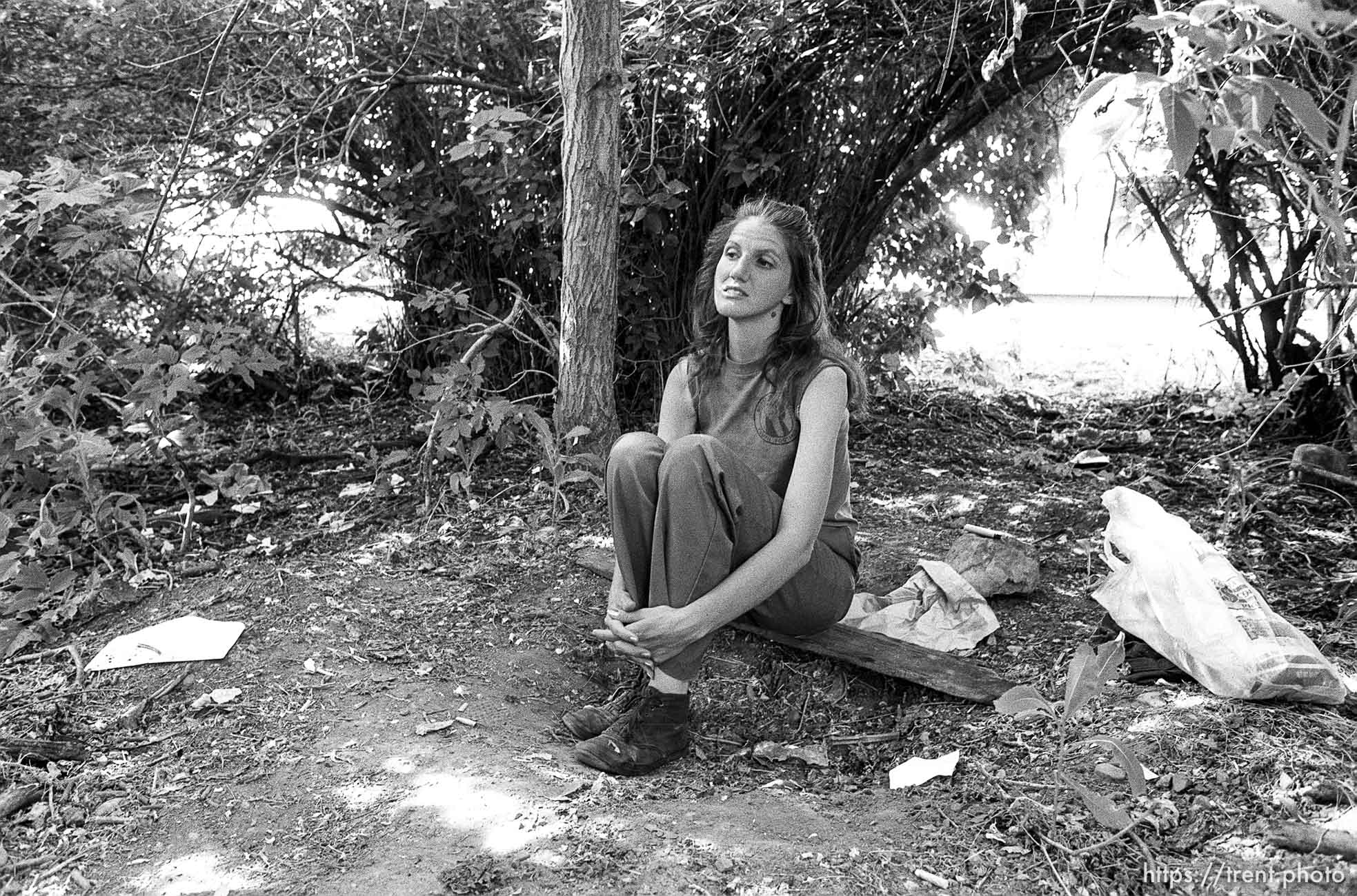 Eva, a Provo woman, sitting in a hobo camp.