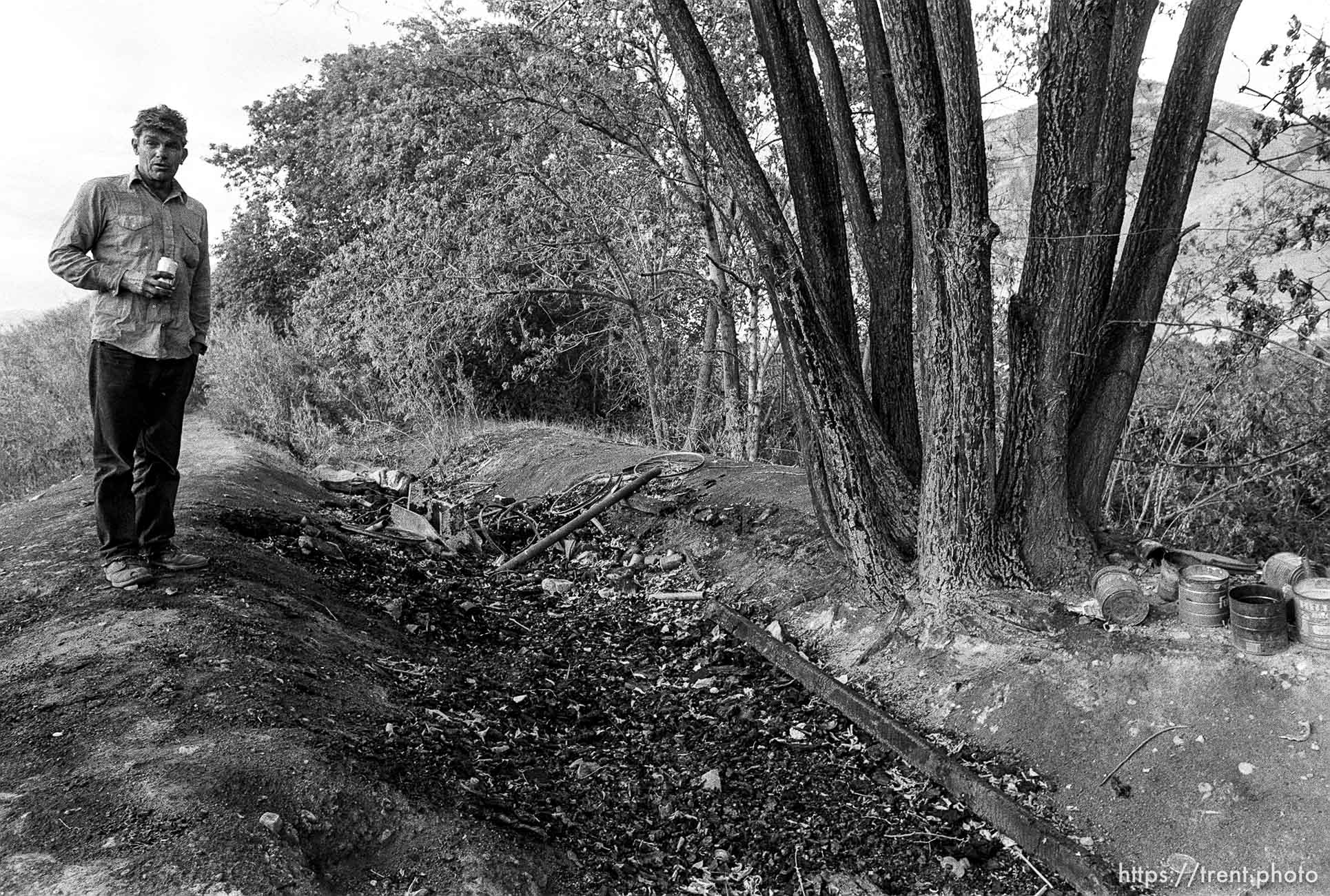 Casey at his camp, which was burned up in a fire while he was away.