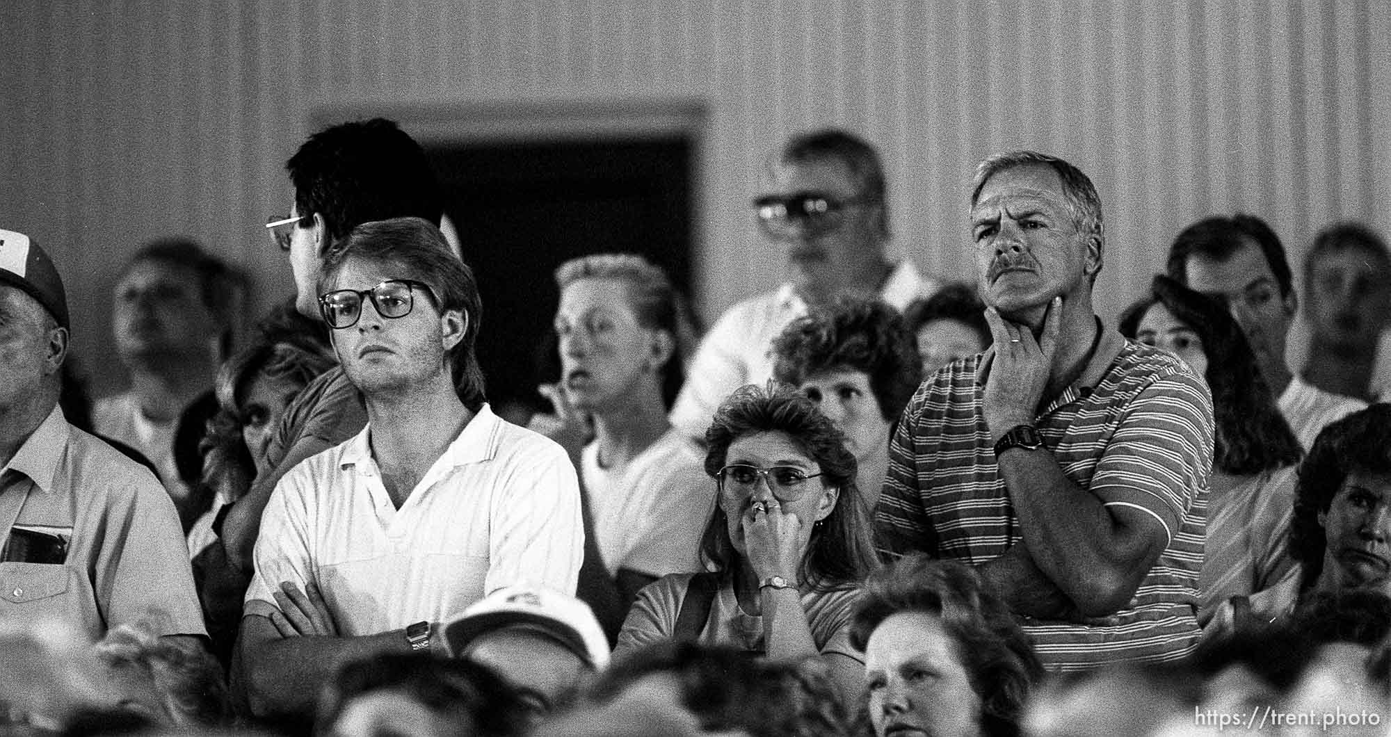 Midway residents listen to officials at a public meeting during the Midway fire.