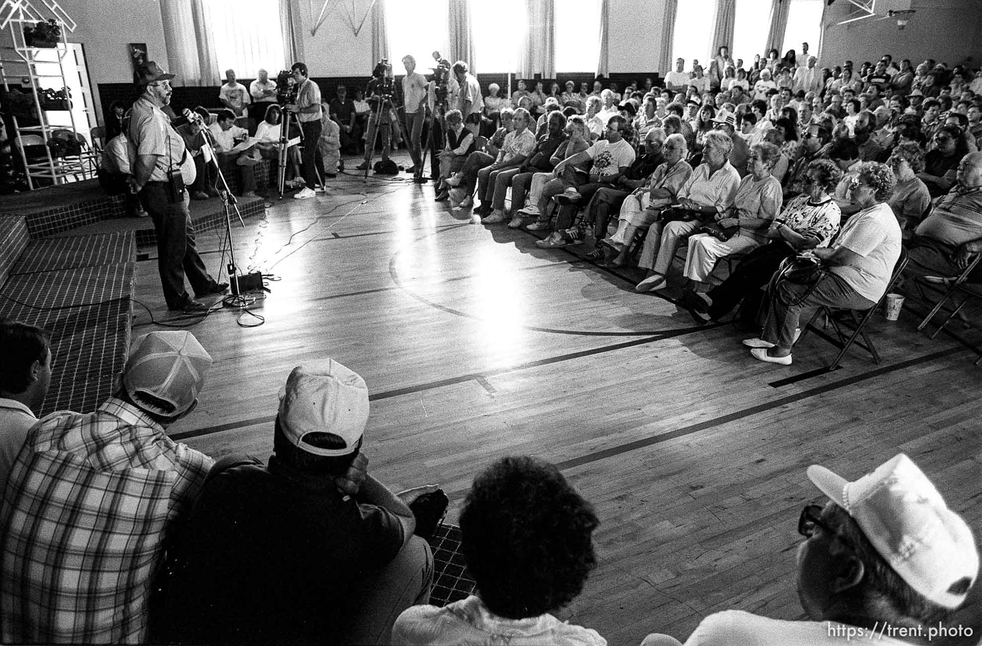 Midway residents listen to officials at a public meeting during the Midway fire.