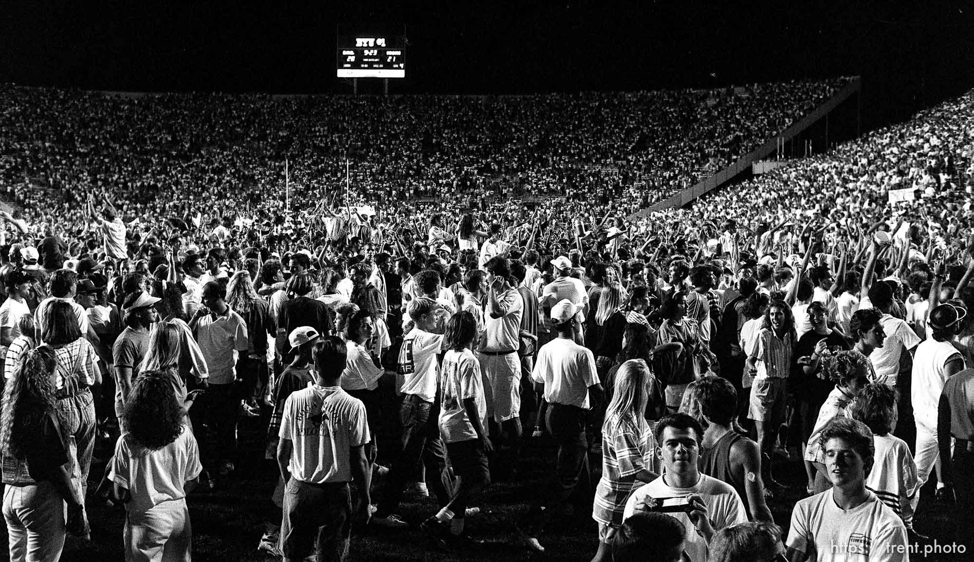 Fans on the field during celebration at BYU vs. Miami. BYU won.