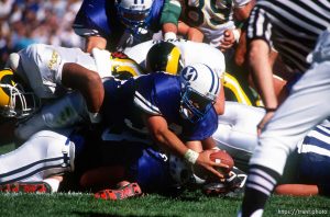 BYU player holds ball out into end zone for a touchdown at BYU vs. Colorado State football.