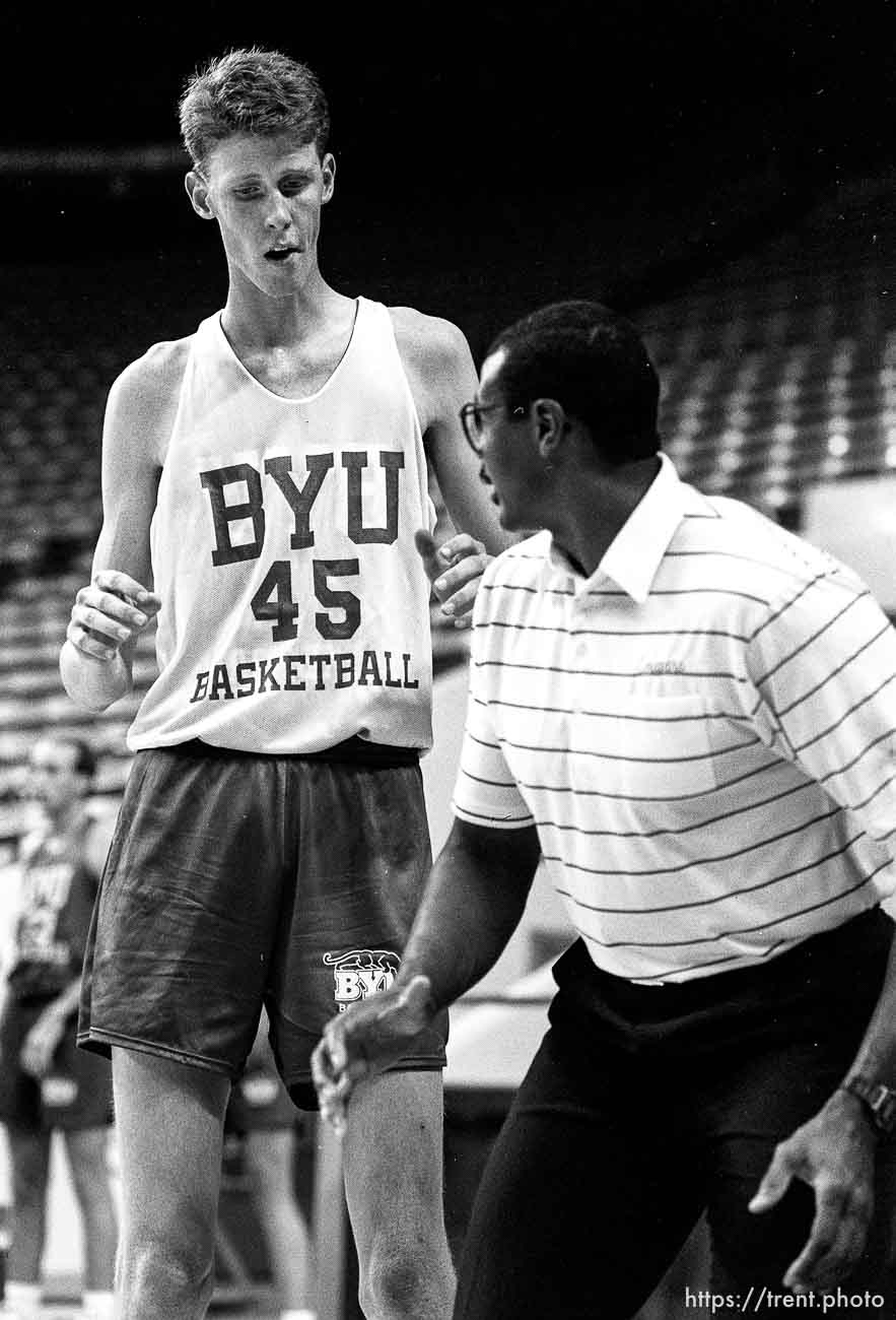 Shawn Bradley and coach at BYU basketball practice.