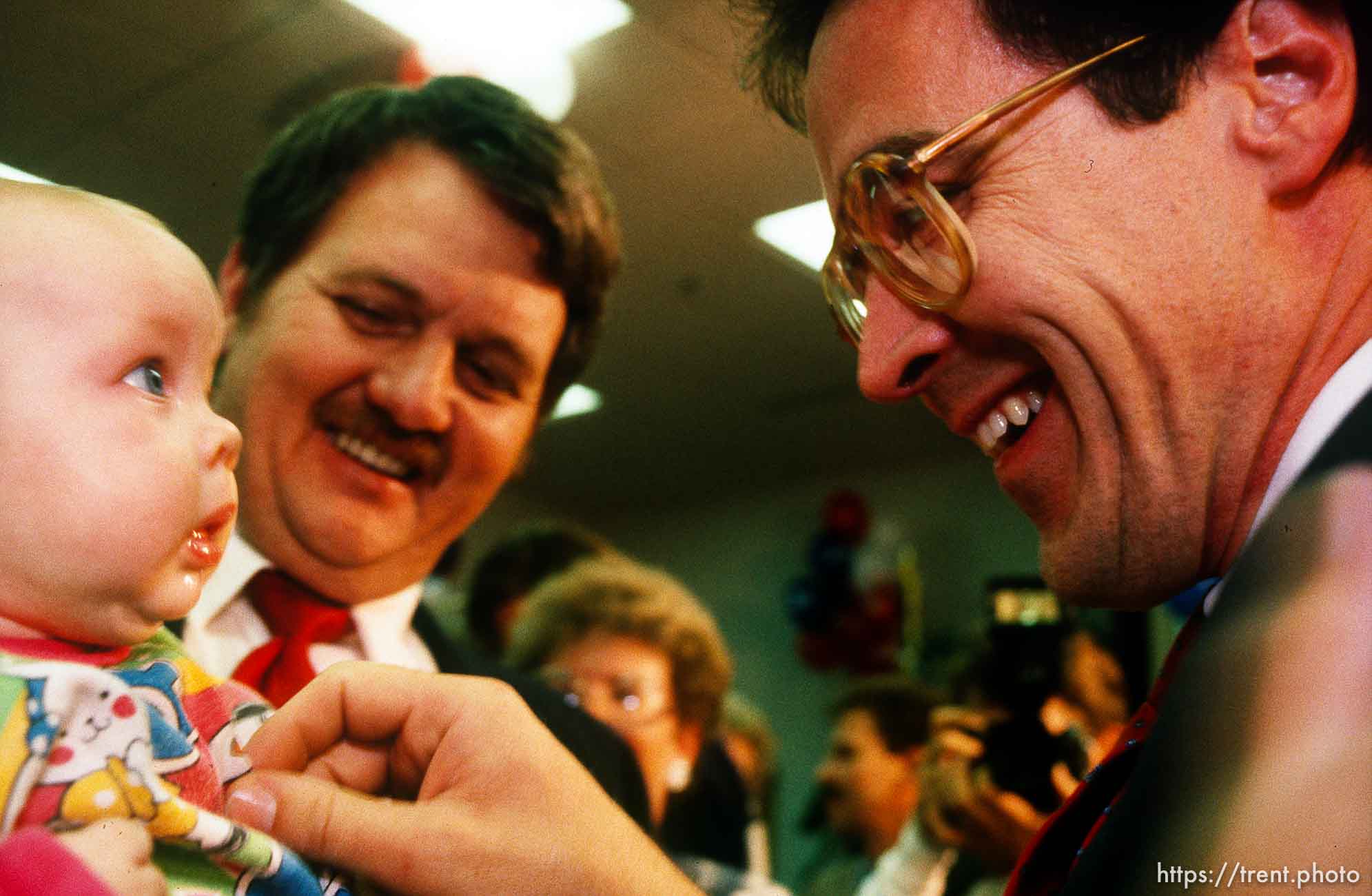 Bill Orton plays with a baby after beating Karl Snow in a Congressional race, 1990.    p