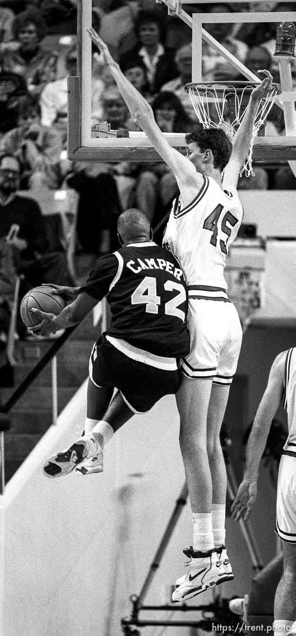 Tall Shawn Bradley with little player going against him at BYU vs. Arizona State.