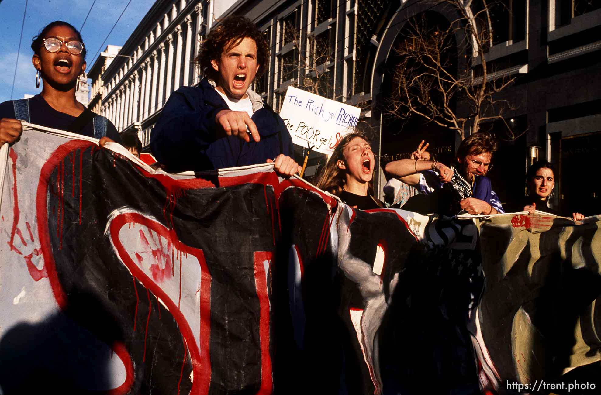 Protesters parade and yell on Market Street at Gulf War protest.