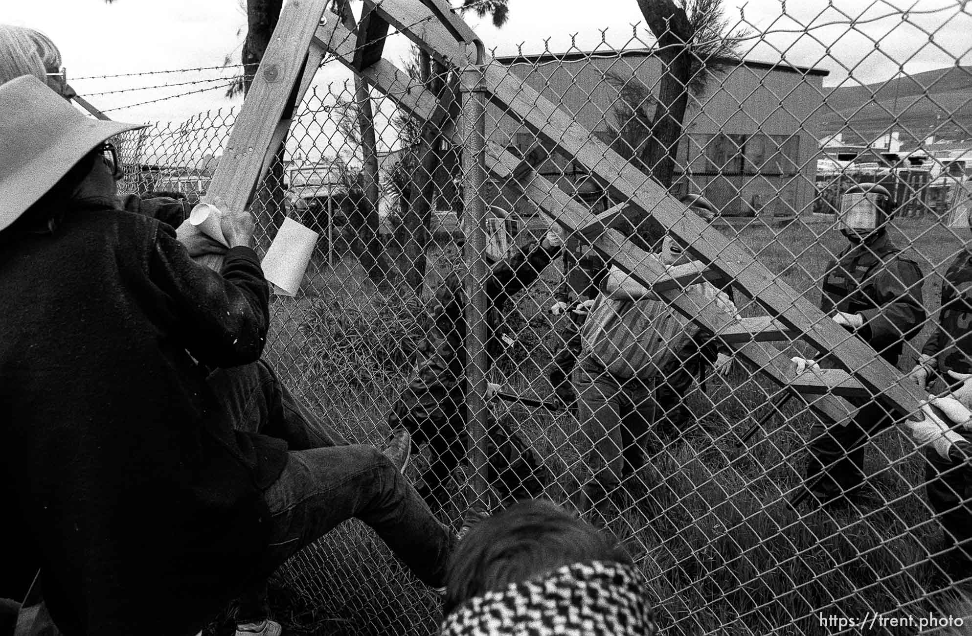 People fight over a ladder at Gulf War protest at the Concord Naval Weapons Station.