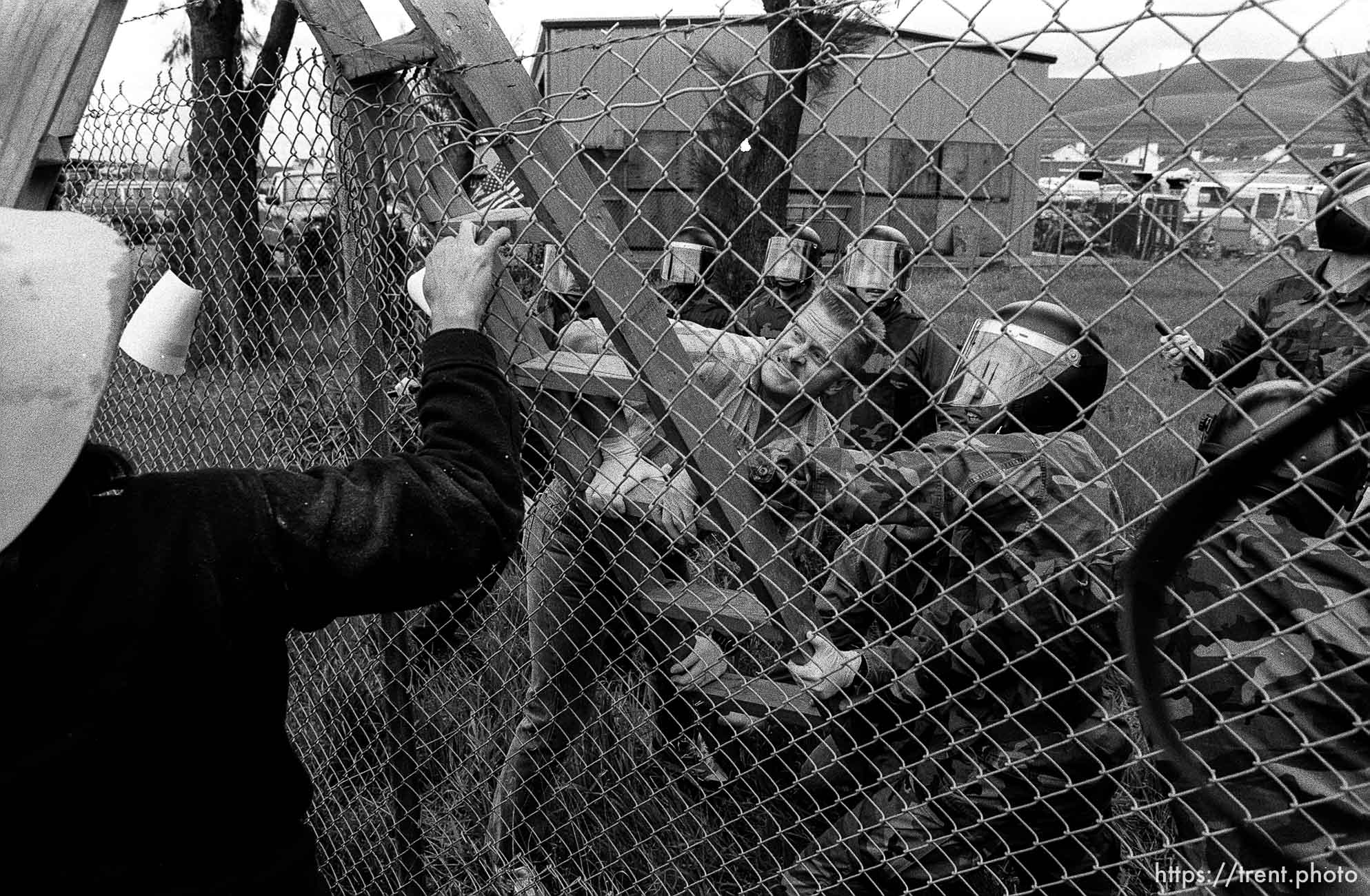 People fight over a ladder at Gulf War protest at the Concord Naval Weapons Station.