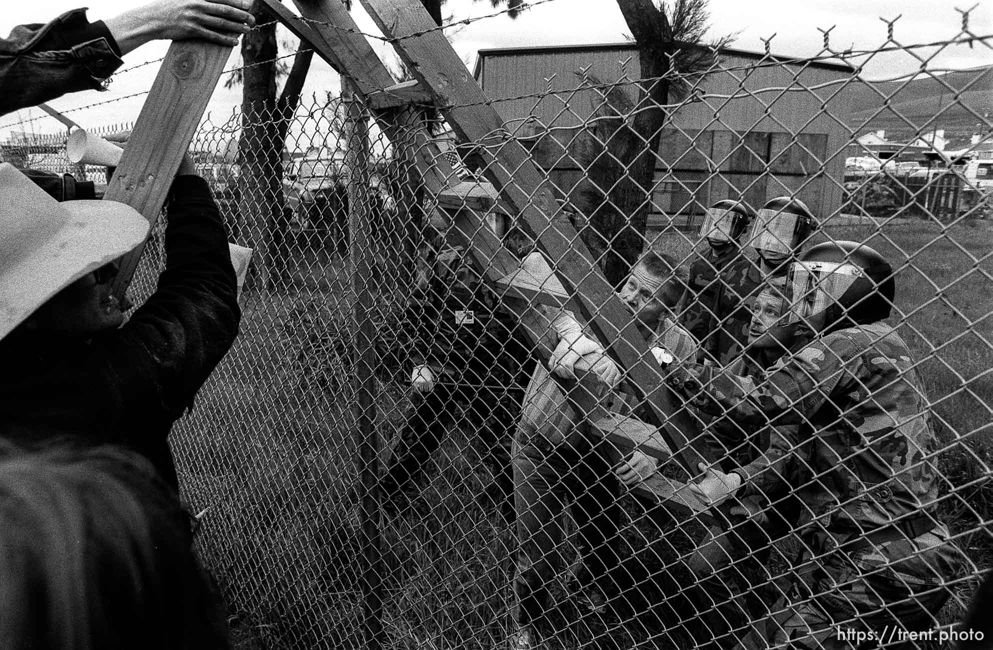 People fight over a ladder at Gulf War protest at the Concord Naval Weapons Station.