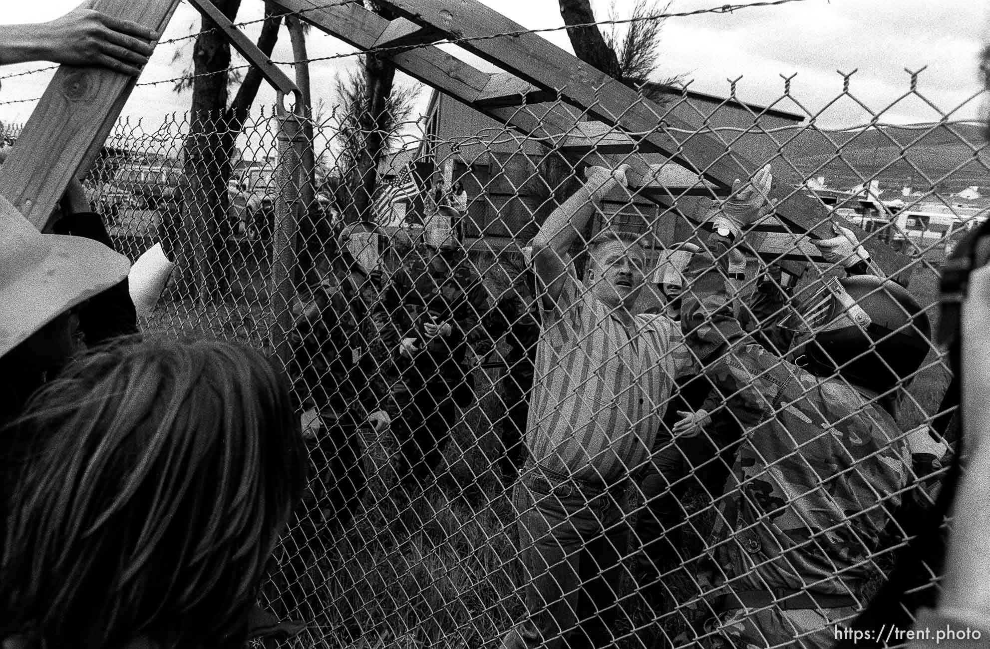 People fight over a ladder at Gulf War protest at the Concord Naval Weapons Station.