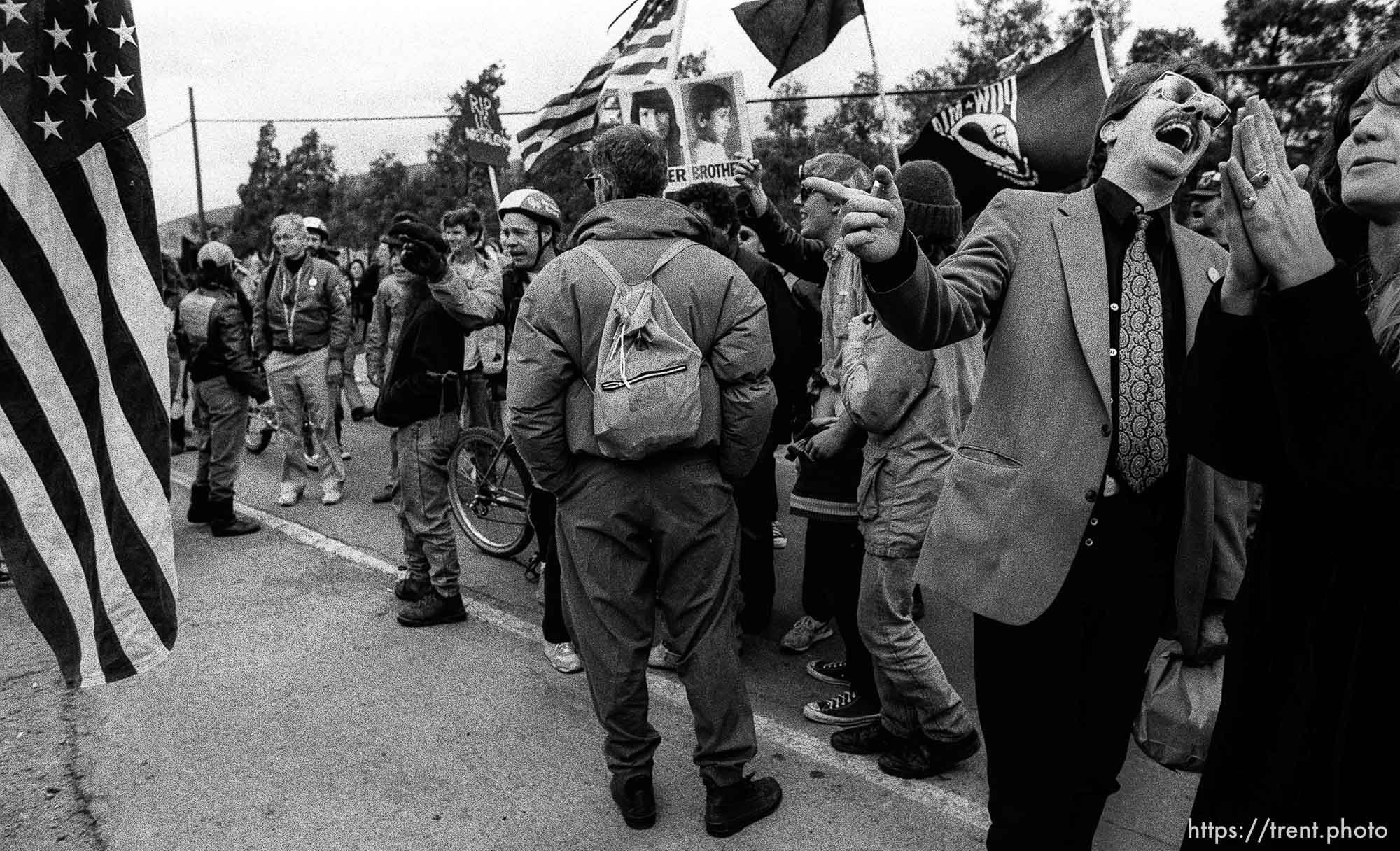 guy laughs at flag at Gulf War protest