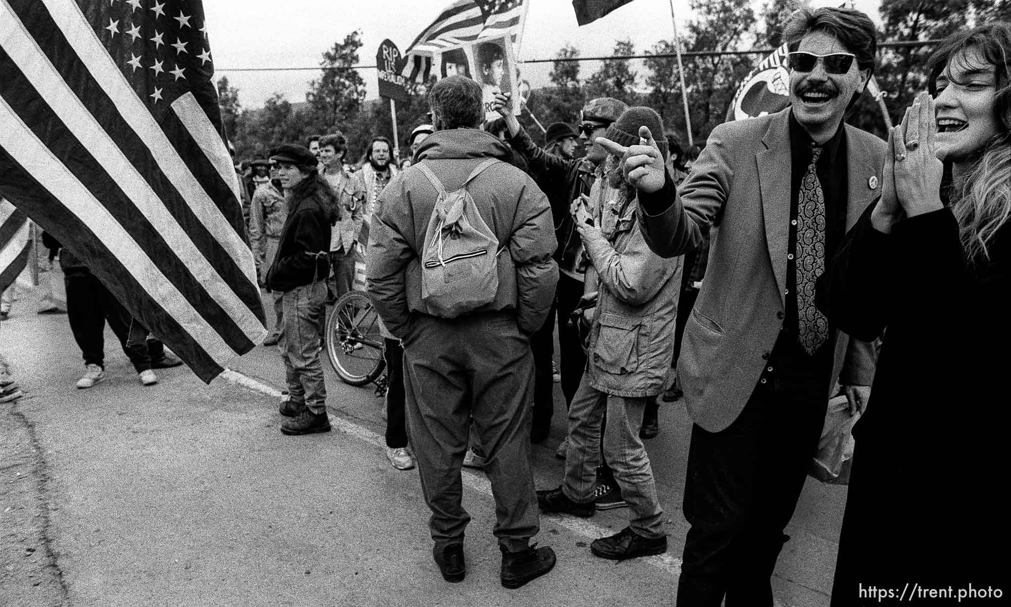 guy laughs at flag at Gulf War protest