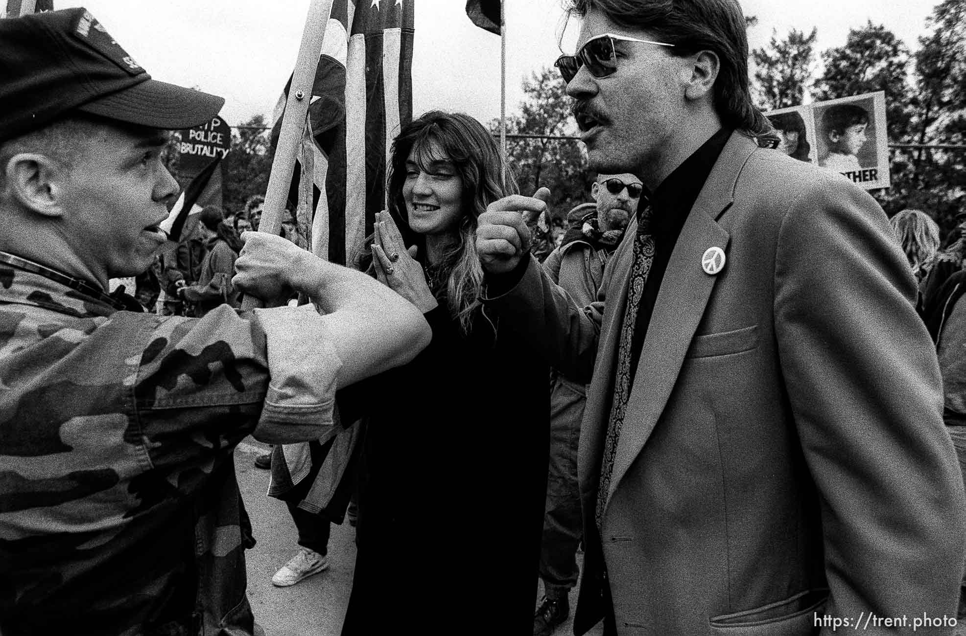 man with flag argues at man who would burn the flag at Gulf War protest