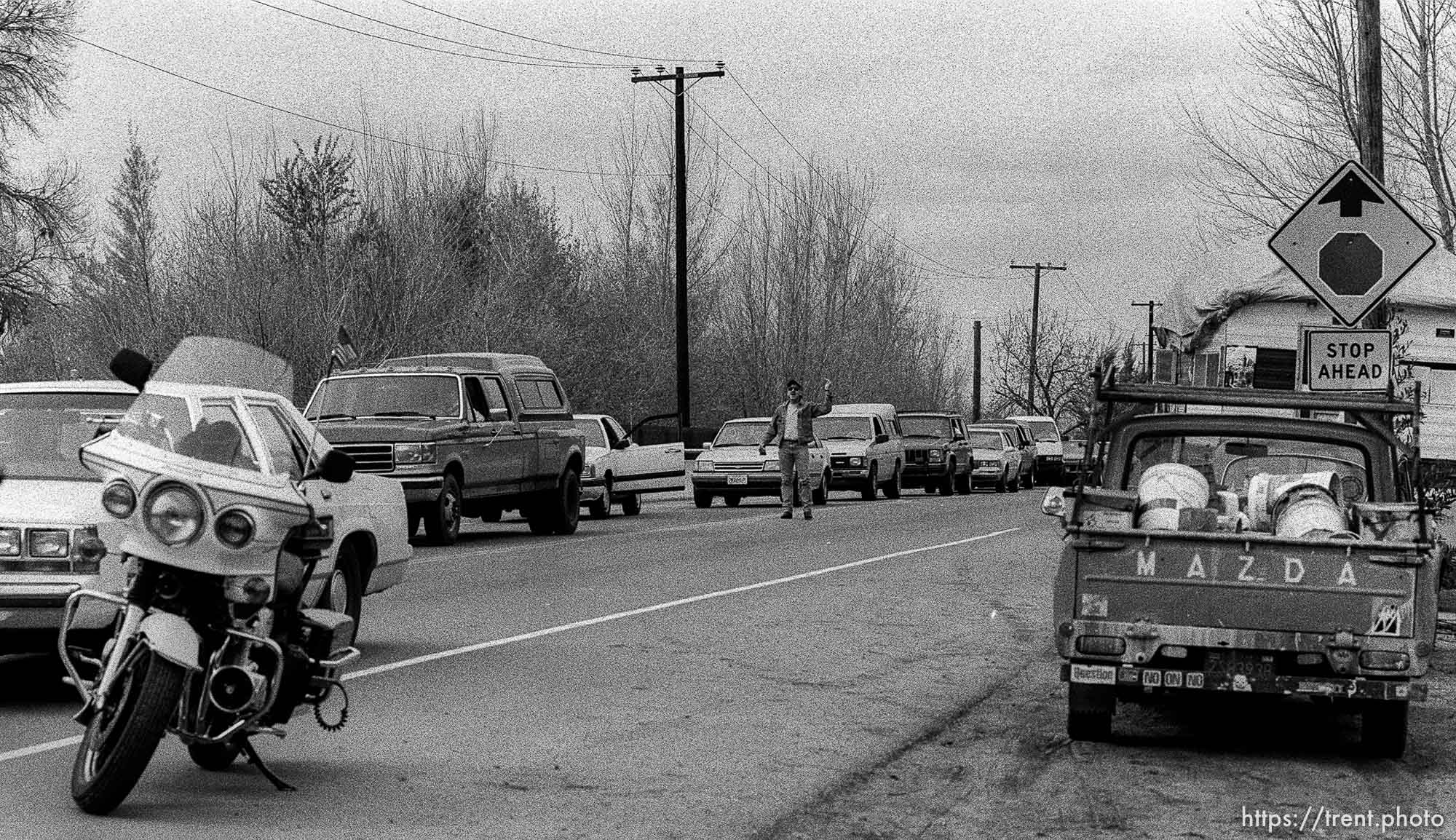 Guy stuck in traffic yelling at Gulf War protesters whose march is blocking the road